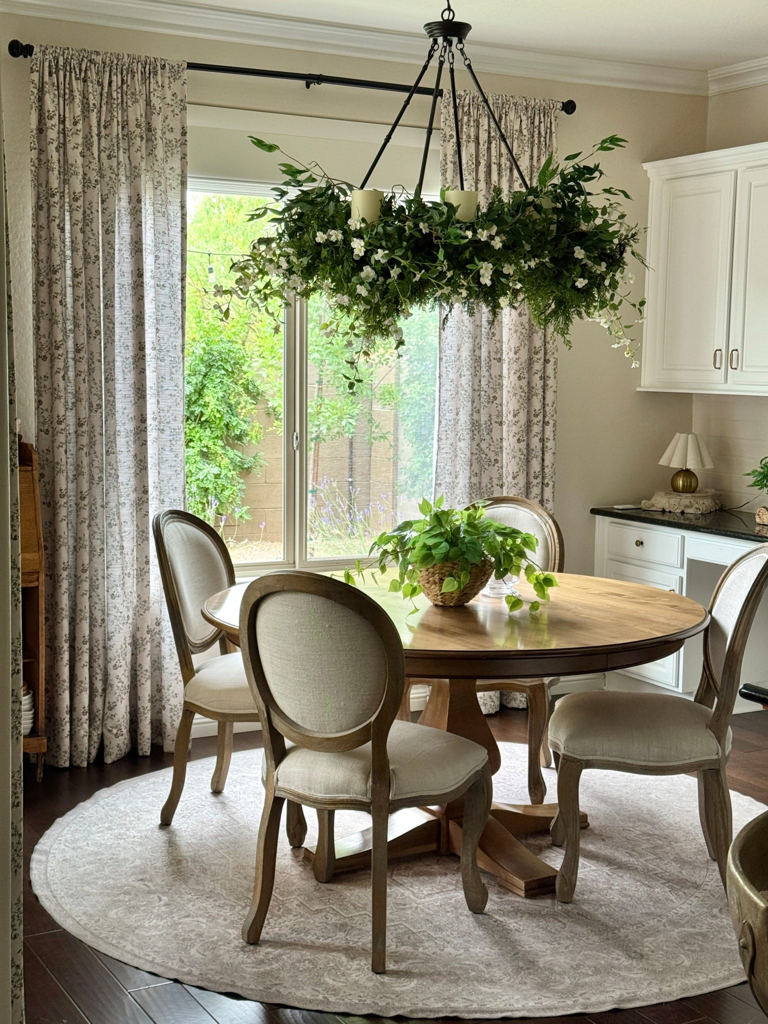 I love decorating my chandeliers with faux greenery, stems and blooms. Seasonally and for everyday! 

I’ve been loving the more bountiful look lately and have used cedar garlands from Christmas (that I never took down) and added in weeping willow garlands for an airy look. Plus, little white flower stems from Target. 

Sadly my specific cedar garlands and white flowers were from Target a few years ago and are no longer available. The weeping willow garlands are (at this point in time) though. But I searched for similar options if you want to recreate this look at home. 

#chandelier #fauxflorals #springhomedecor #budgetfriendly

#LTKFindsUnder50 #LTKFindsUnder100 #LTKHome