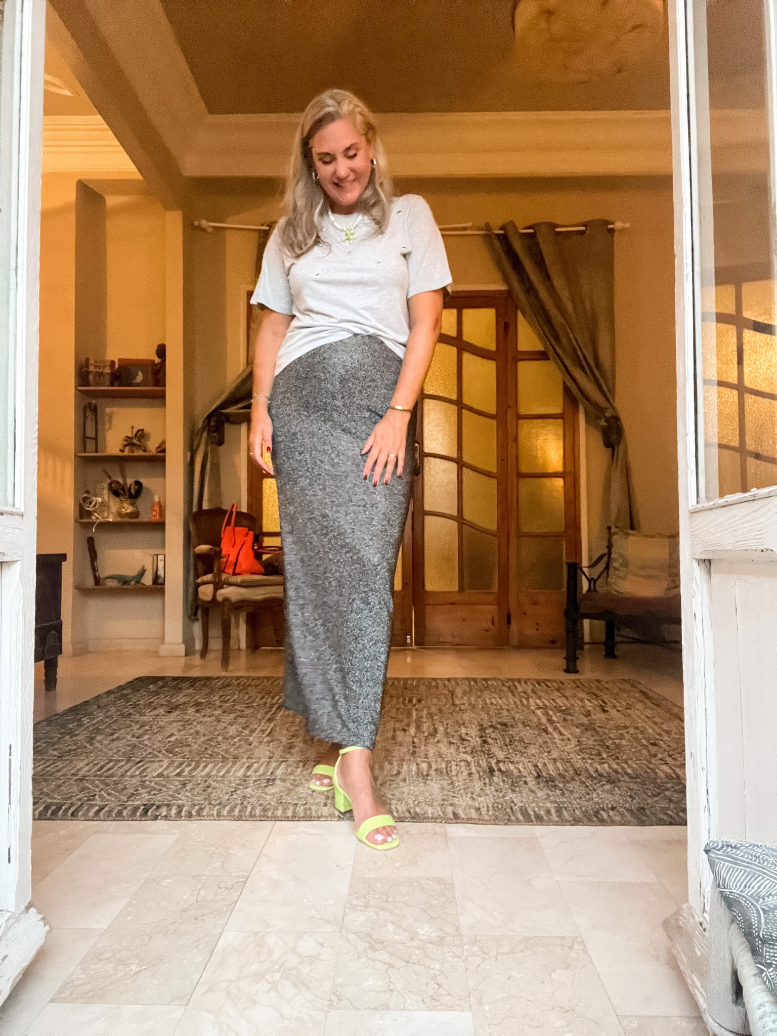 Ootd - Monday night. Heather grey t-shirt with metal rings, glitter maxi skirt, neon heeled sandals, beaded necklace with a balloon dog figure. 

#LTKstyletip #LTKeurope #LTKtravel