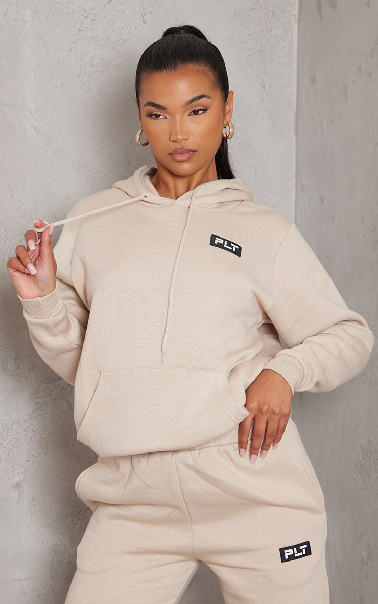 PRETTYLITTLETHING Sand Logo Badge Detail Oversized Hoodie | PrettyLittleThing US