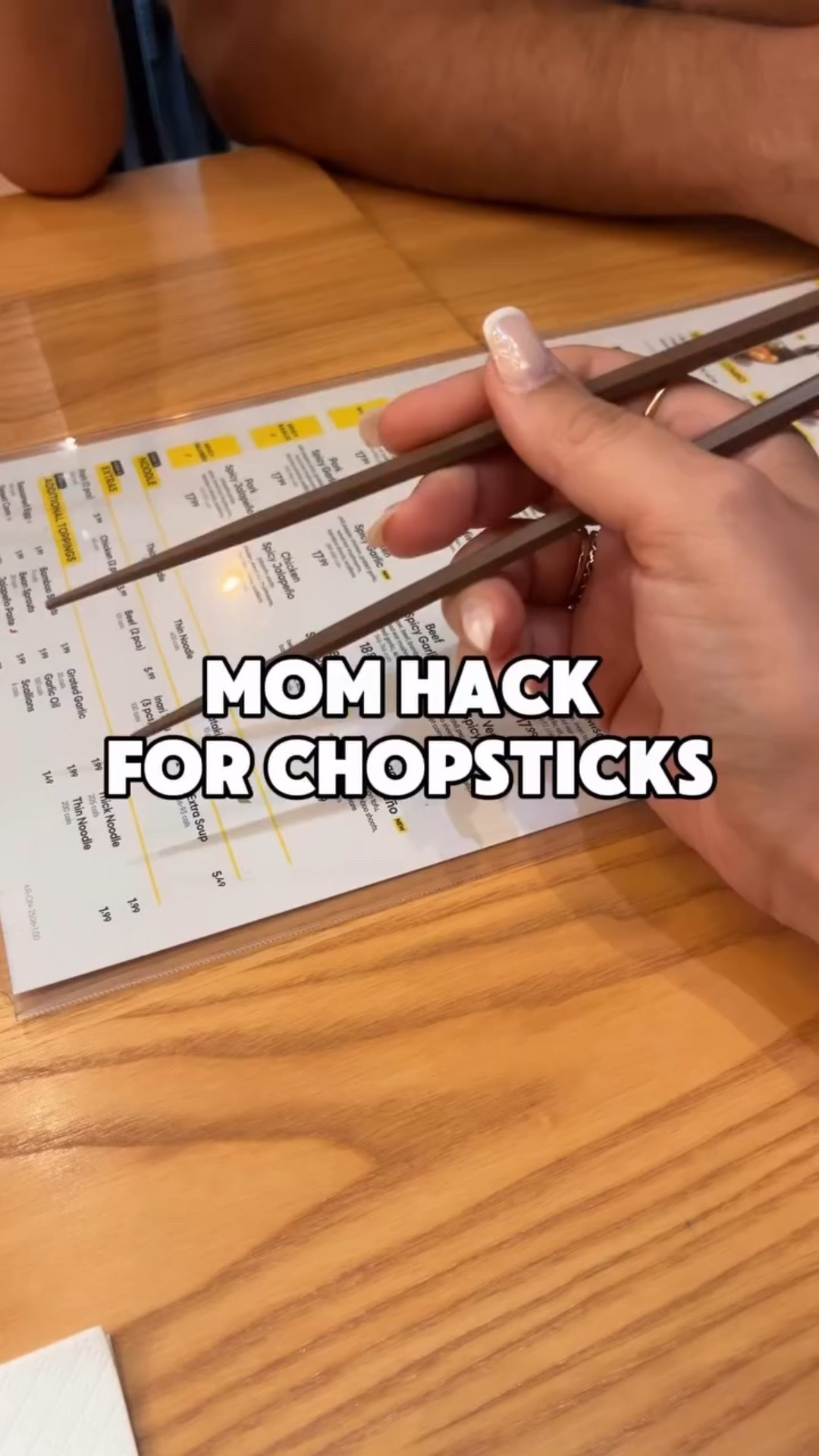If you’ve ever brought kiddos to sushi or ramen, you know they want to use the chopsticks too but it’s hard for their little hands 👧 

Well not anymore with this super simple #momhack ! 🙌🏻 

Just use the napkin at the table to wrap the tops of the chopsticks (leave a little gap between them) and then fold the napkin in half so it holds the chopsticks together. The tension caused by the folded napkin almost turns the chopsticks into tongs, which is WAY easier for little hands or those with fine motor mobility issues. 🥳 

Would you try this one? Tell me in the comments 💁🏻‍♀️

And share with another family who loves to dine out with their kids!! 🫶 

#momhacks #lifehacks #canadianmoms #kitchenhacks #kitchentipsandtricks #lifehack #ramen #sushi #chopstickhack 

Hack for helping kids use chopsticks 
How to use chopsticks