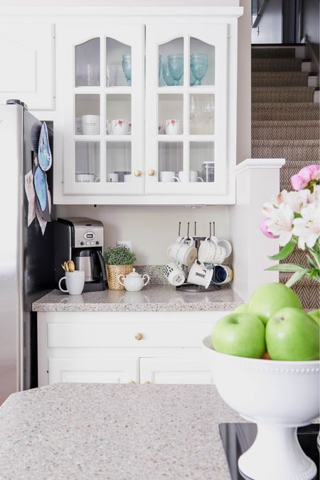 This is the perfect coffee bar area with a cute mug stand and more mugs in the cabinet above.

#LTKHome