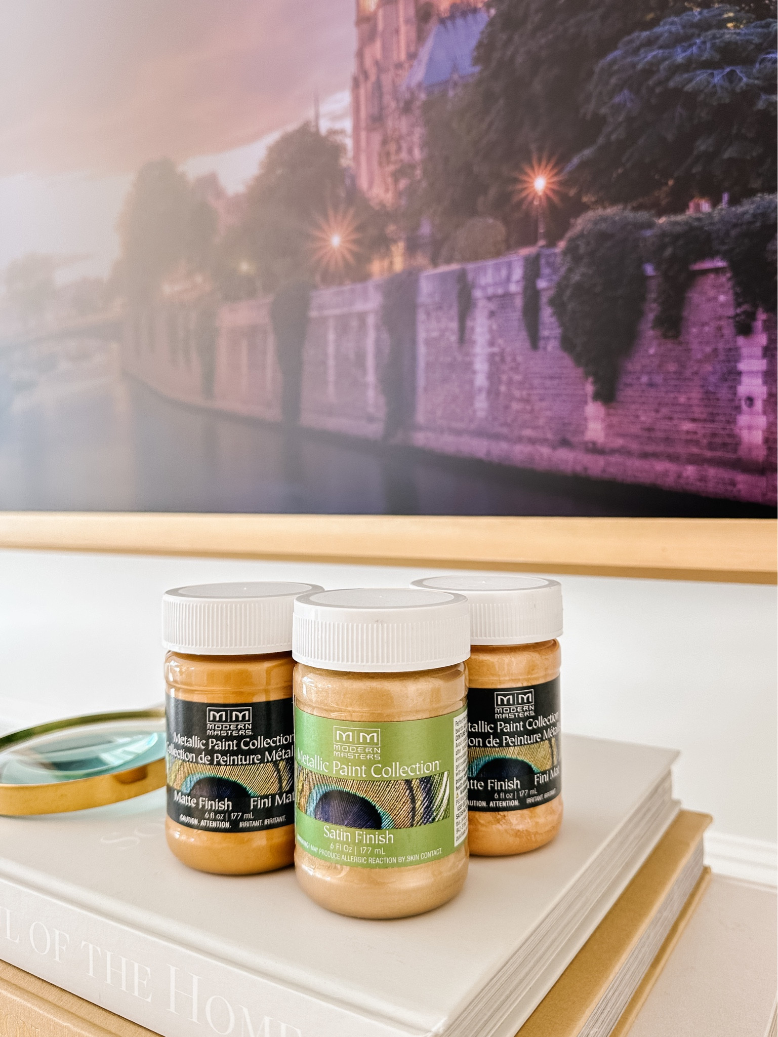 I painted my narrow bevel Samsung frame using Modern Masters Pale Gold paint. For this larger piece I primed the frame first then layered the paint on top of that. 

You can layer the paint on items alone (I do that all the time) but you will need to layer it quite a bit to get to a more consistent look. I’ll oftentimes just add the pale gold on things until I achieve the color I want. It doesn’t need to be perfect. 

Adding several of my favorite Modern Masters paint colors below as well as some of the TV frames we have and love. 
The larger Deco frames (in Jeff’s office) are made of wood or alloy and have more choices. 


#LTKhome