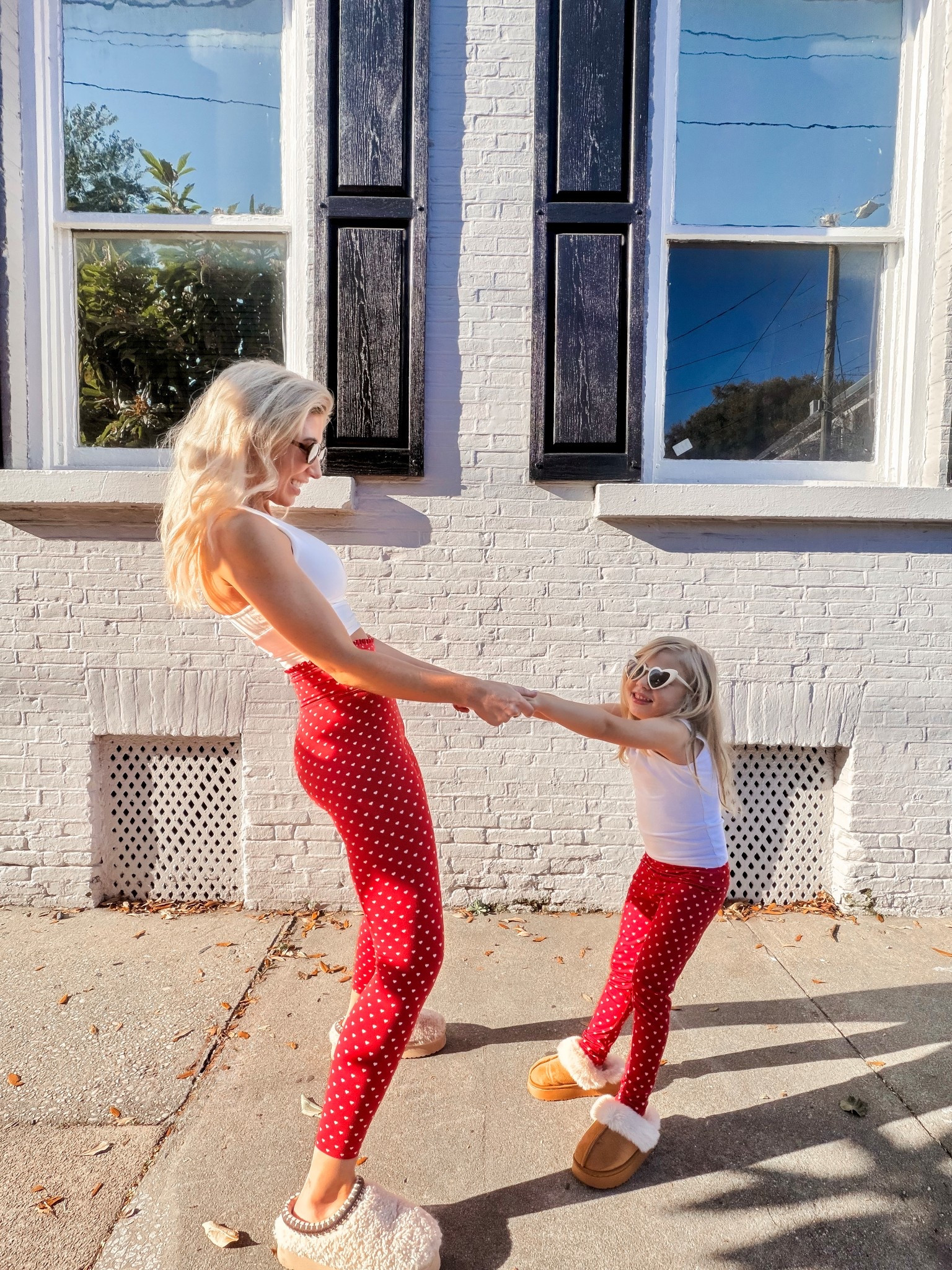 Matching mom and me leggings from Target 🤍 Valentine’s hearts, sunshine, and tiny humans glued to my side—my favorite kind of match.