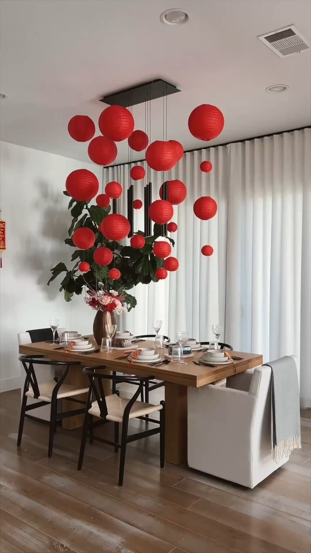 Lunar New Year decor for our dining room! Love these red paper lanterns and I hung them with clear fishing wire and command hooks. Set our table with Arhaus dinner plate, salad bowls and cereal bowls. 

#LTKHome #LTKSeasonal