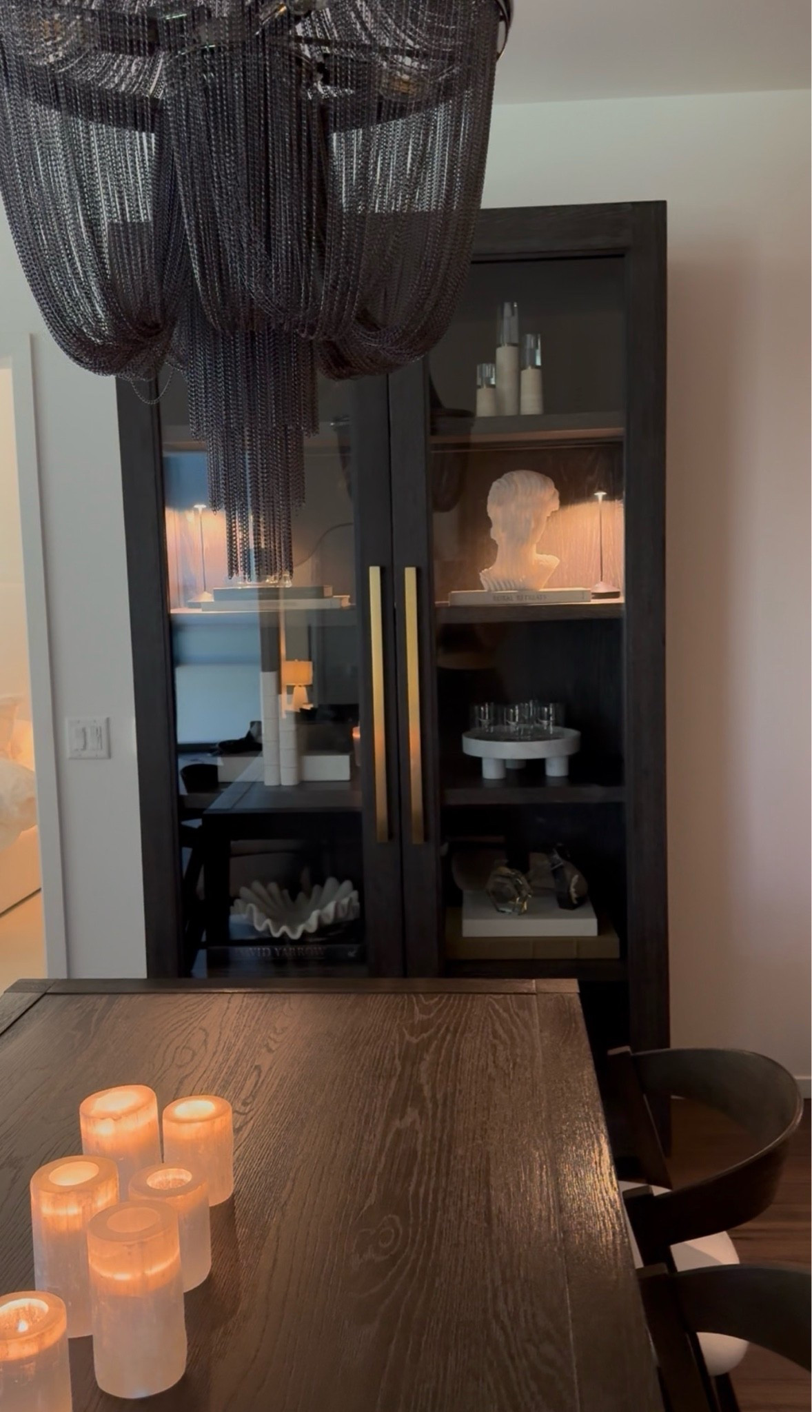 Organic modern cabinet styling- use code ET05 at zgallerie


Black chandelier, coffee table books, marble bowl, marble tray, bust

#LTKSaleAlert #LTKHome