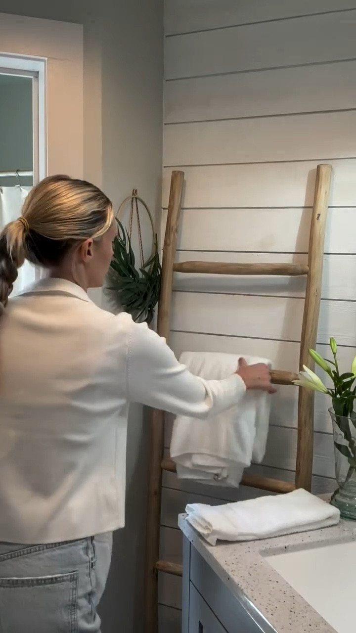 Here are a few easy tips to make your bathroom feel high end:
1 - use a refillable glass soap dispenser 
2 - get a small tray to hold your soap - I paired mine with greenery, but you could also do a 2nd refillable dispenser for lotion
3 - upgrade your storage - I love these striped canvas totes I found at TJ Maxx - anything to hide clutter in a stylish way!
4 - add a simple floral or eucalyptus 
5 - use white linens - these always feel clean and crisp!

#ltkhome #ltkstyletip #interiordesign #home #interior #bath #bathroom #bathroomdesign #bathroominspo #homedecor #decor #interiors #styling #interiorstyling