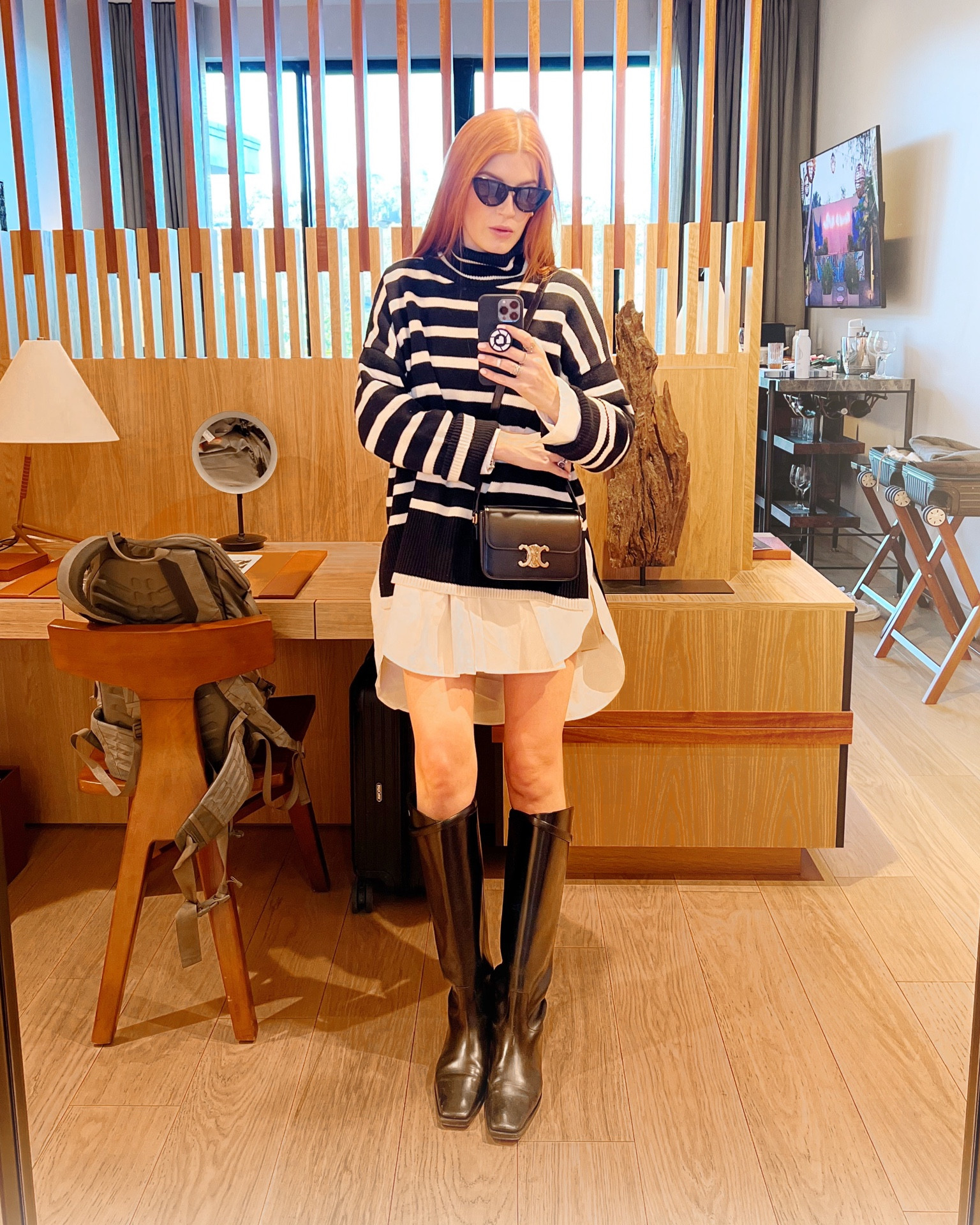 I layered this trending striped Toteme sweater over my Asos shirt dress for a business conference in San Francisco. I wear these boots and this bag daily which brings the price per wear way down 🏆

#LTKworkwear #LTKtravel #LTKU