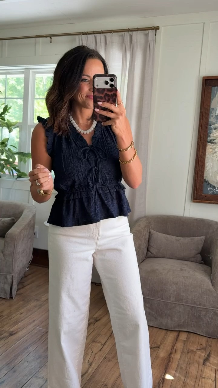This outfit is such a good elevated everyday look 🤍 The navy top is lightweight, feminine, and has the cutest little details with the ties and ruffle sleeves. Paired with these white jeans makes it feel super classy and put together without trying too hard. 

I love outfits like this because they’re easy to wear but still look polished and expensive. Perfect for lunch dates, church, casual work days, errands, or summer nights out ✨ Walmart has honestly been SO good lately with affordable staples. 

Size XS, 5’3 for reference