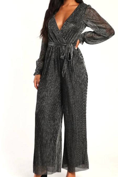 This silver metallic jumpsuit is perfect for New Year’s Eve! The wide legs are flattering on curvy women too! #newyearseveoutfit 

#LTKunder100 #LTKcurves #LTKSeasonal