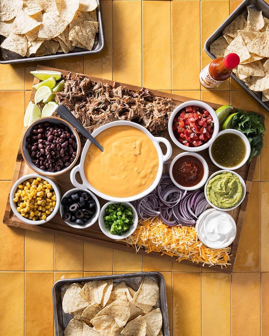 This nacho toppings bar really ups the party snack ante! I know it’s hard to imagine that nachos can get much better than they already are, but what if I told you that everyone could customize their own plate of nachos based on what they think are the best toppings?

#LTKSeasonal #LTKfoodie