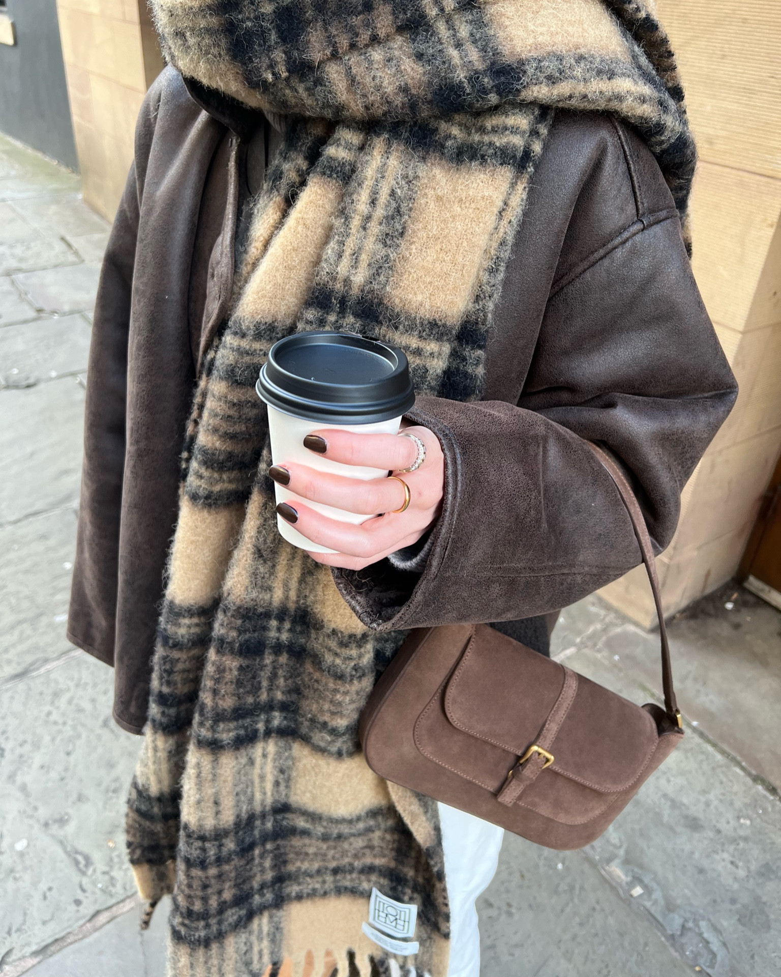 shearling coat from mango in brown (also comes in black) 
toteme scarf 
toteme scarf dupe from arket 
toteme white jeans 
white jeans from arket 
ultra mini uggs in chestnut 
brown suede miranda bag from by far (in the sale) 
off duty casual style 
weekend style 
comfy style 

#LTKeurope #LTKSeasonal #LTKstyletip