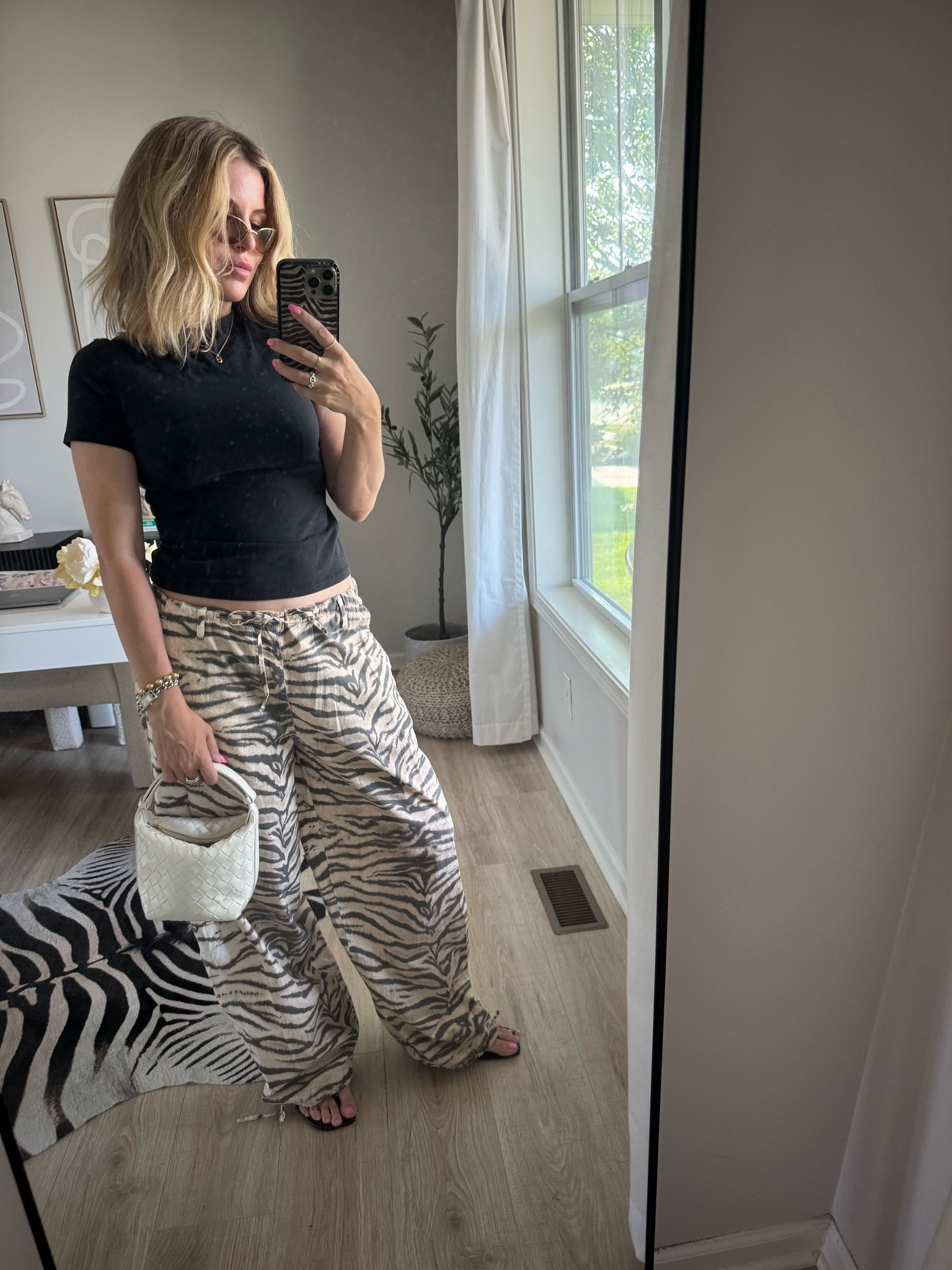 Tiger print pants wearing size 6, super loose and baggy just how i like it.

#LTKootd #LTKOver40 #LTKWorkwear