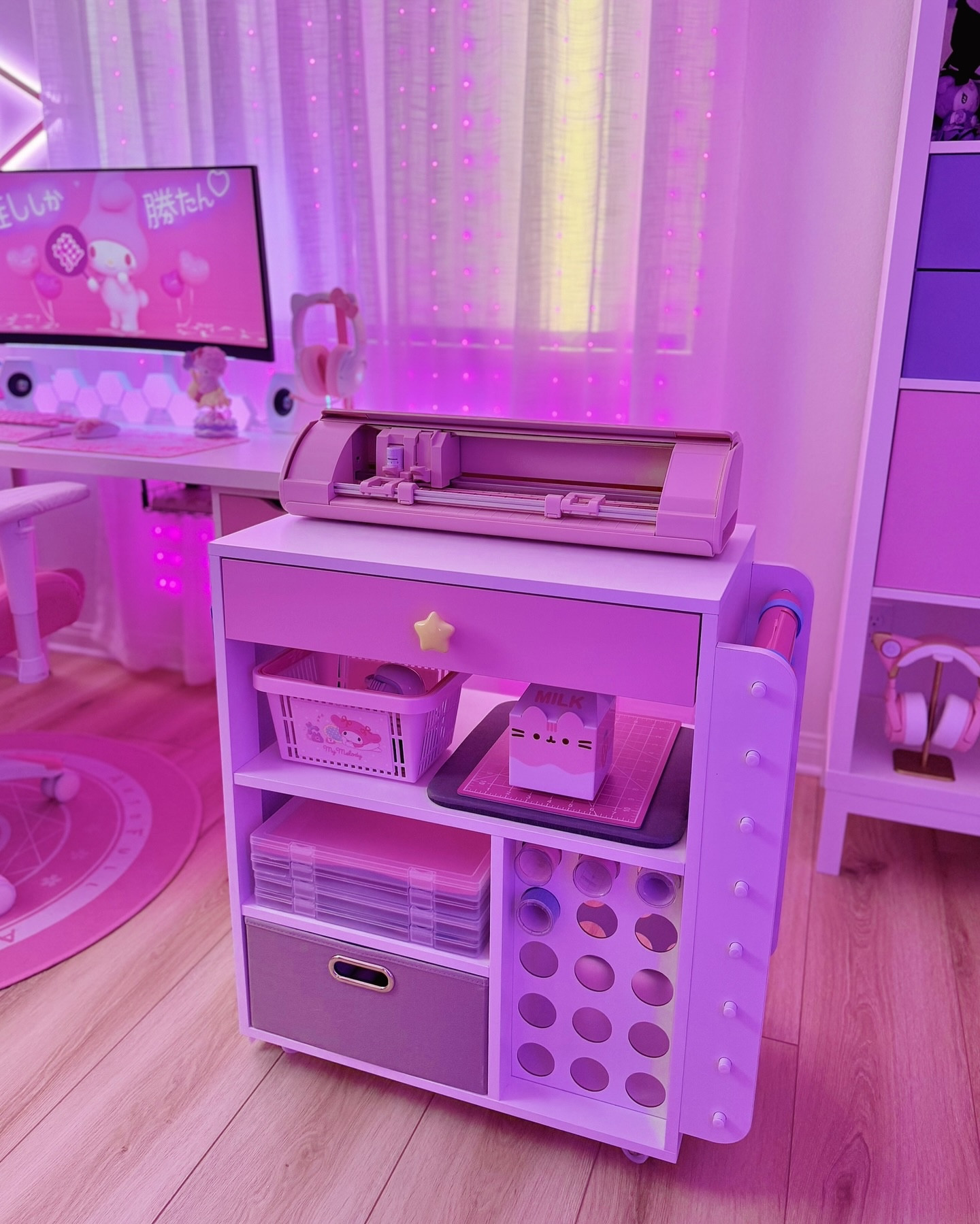 The CUTEST rolling craft cart! 💕 I wanted a convenient way to store all my vinyl crafting supplies, but of course I had to match it to my gaming room aesthetic! I customized this rolling cart with:

- Pastel pink chalk paint on the drawer front + a star shaped drawer pull ⭐️
- Vinyl sheet storage + organizers
- Tool storage + baskets to store supplies

My pink Silhouette Cameo 5 sits on top, and you can store vinyl rolls on the front and sides ~ ✂️✨ There’s also a hook on the opposite side to hang cutting mats.

Linked everything below so you can organize your vinyl cutting station too!

🎀🌟🎀🌟🎀🌟🎀

crafts, kawaii desk setup, home office, craft room storage, pastel decor, crafting station, DIY, organization, craft room, storage, cutting machine, vinyl crafts

#LTKHome #LTKStyleTip #LTKFamily