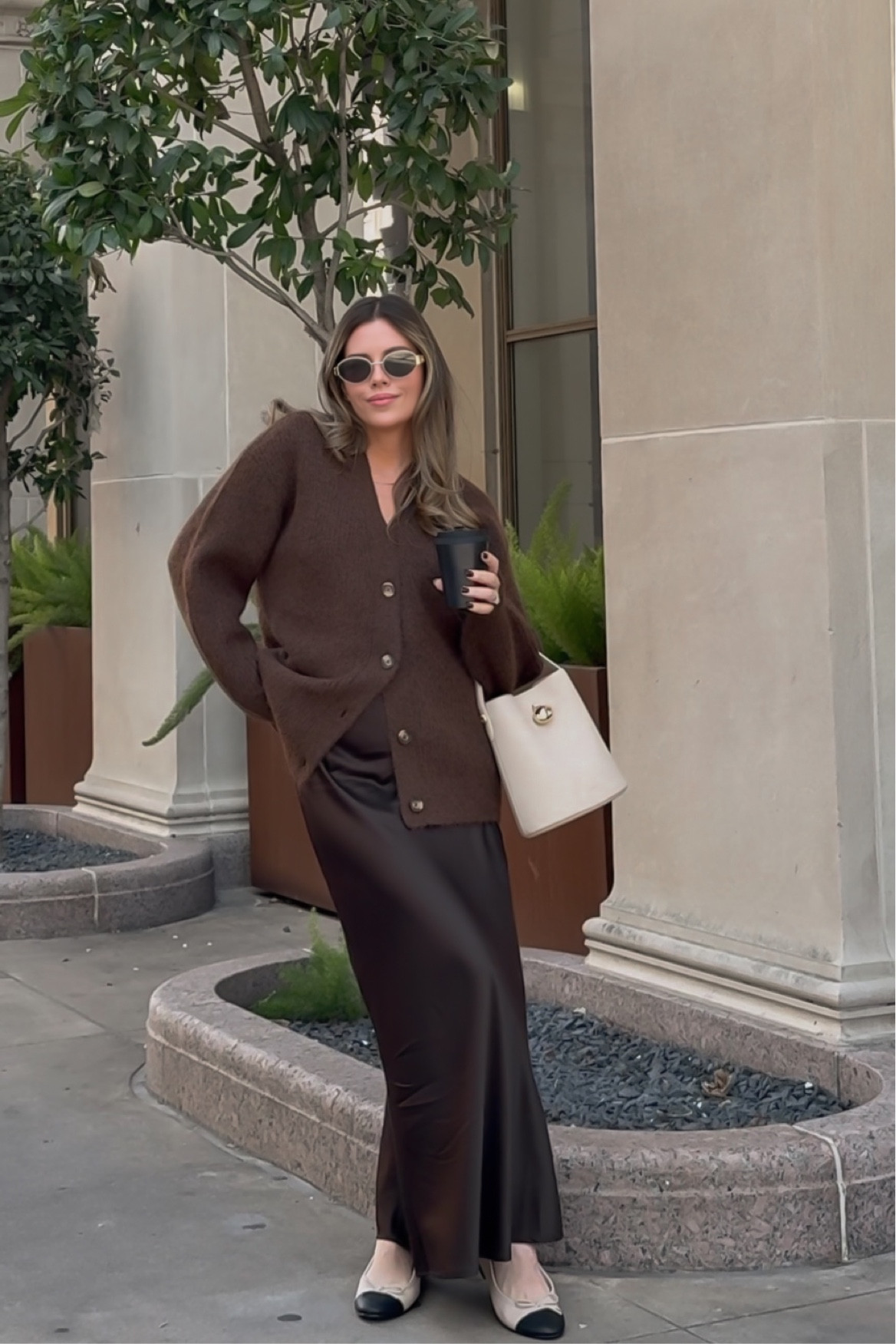 Brown chunky knit sweater with brown silky skirt

#LTKStyleTip