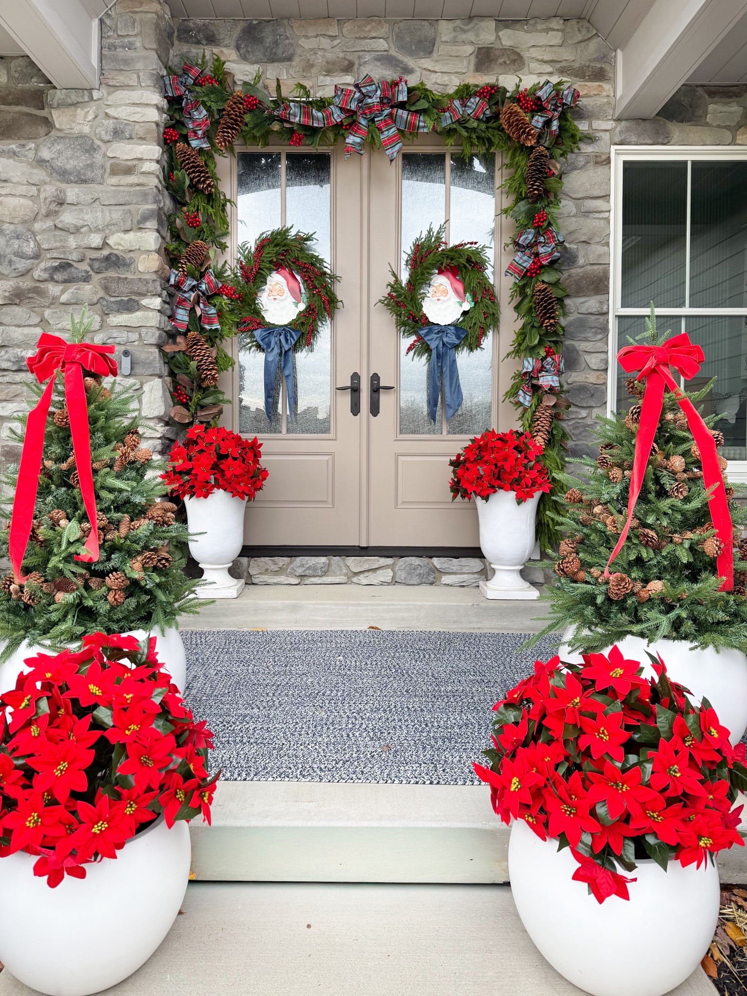 Welcome to my 2025 Christmas porch! I’ve linked everything here with the exception of the tulip shaped planters near the front door since those were a HomeGoods find. I layered the garlands (Norfolk deluxe + magnolia berry). I fastened the sugar pine cones and plaid ribbon to the garland using zip ties and floral wire  

#LTKHome #LTKSeasonal #LTKHoliday