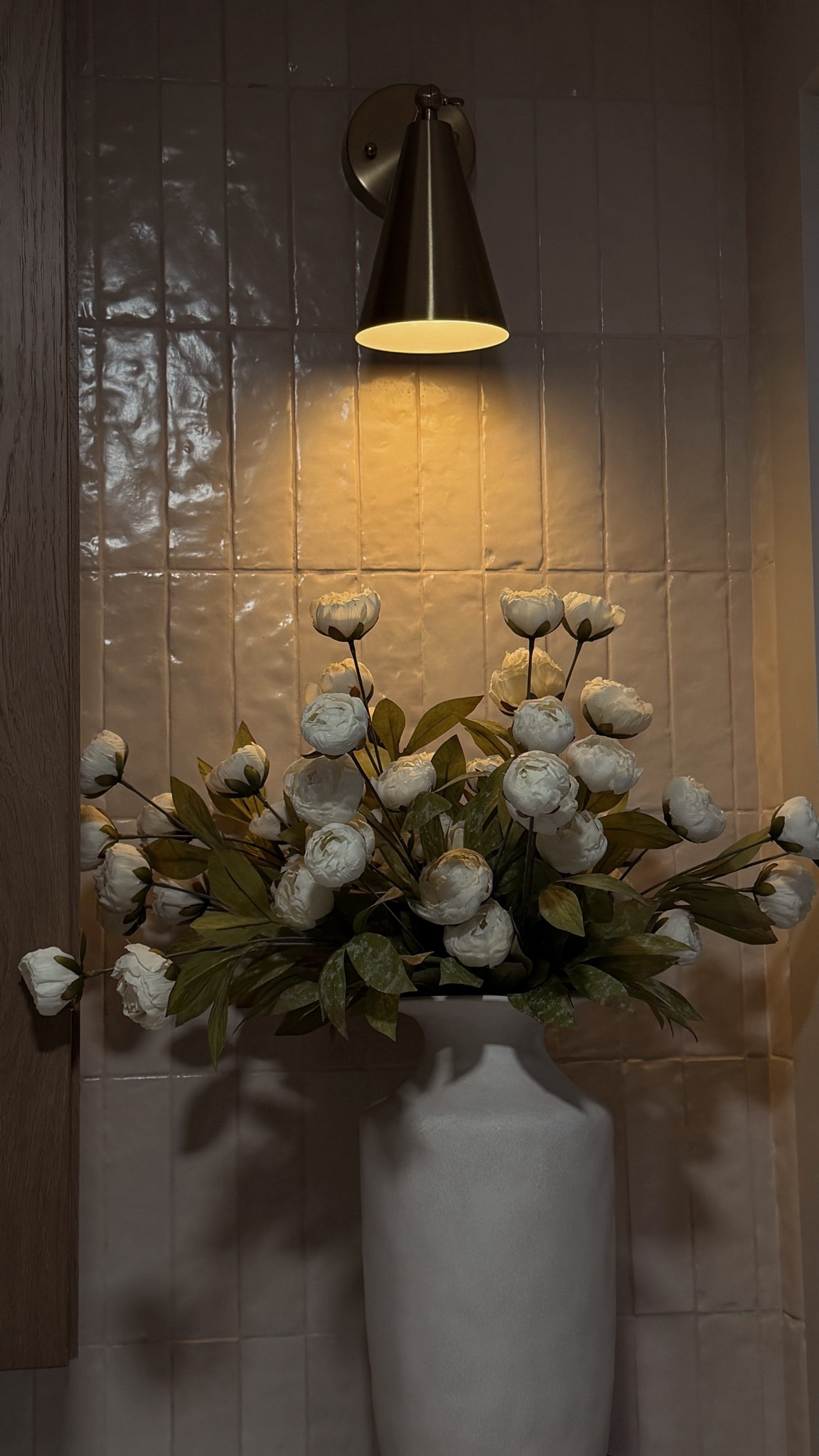 I love adding a touch of nature to my space. Check out this gorgeous ceramic vase with fresh flowers. It brightens up any room! #HomeDecor