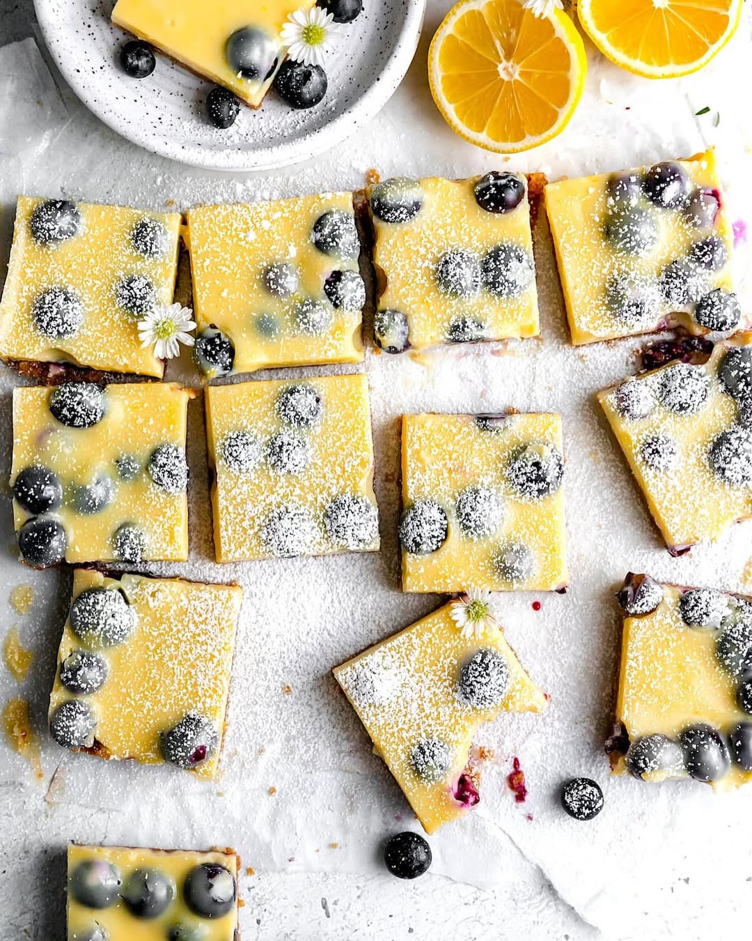LEMON BLUEBERRY BARS

These Lemon Blueberry Bars are a must-bake this summer! 🍋🫐

With a buttery graham cracker crust, a luscious, tangy lemon filling, and bursts of sweet, juicy blueberries, every bite is bright, creamy, and totally irresistible. They’re super simple to make—perfect for BBQs, picnics, or just because! ☀️💛 Full recipe on my blog: https://www.twopeasandtheirpod.com/lemon-blueberry-bars/ 

 #LTKHome #LTKFindsUnder50 #LTKFindsUnder100