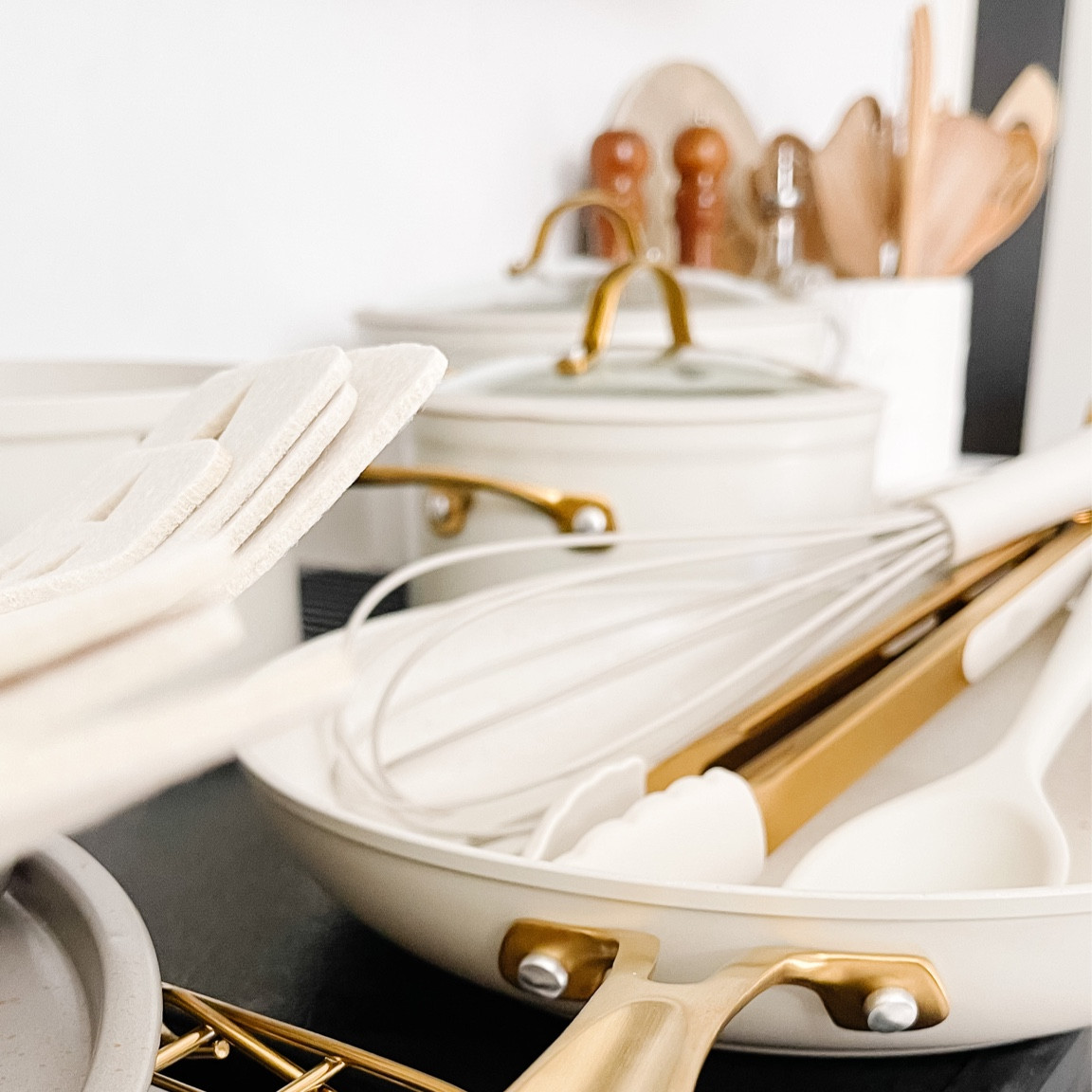 Kitchen utensils, tan pots and pans, baking sheets. All on sale!

#LTKhome #LTKCyberweek #LTKsalealert