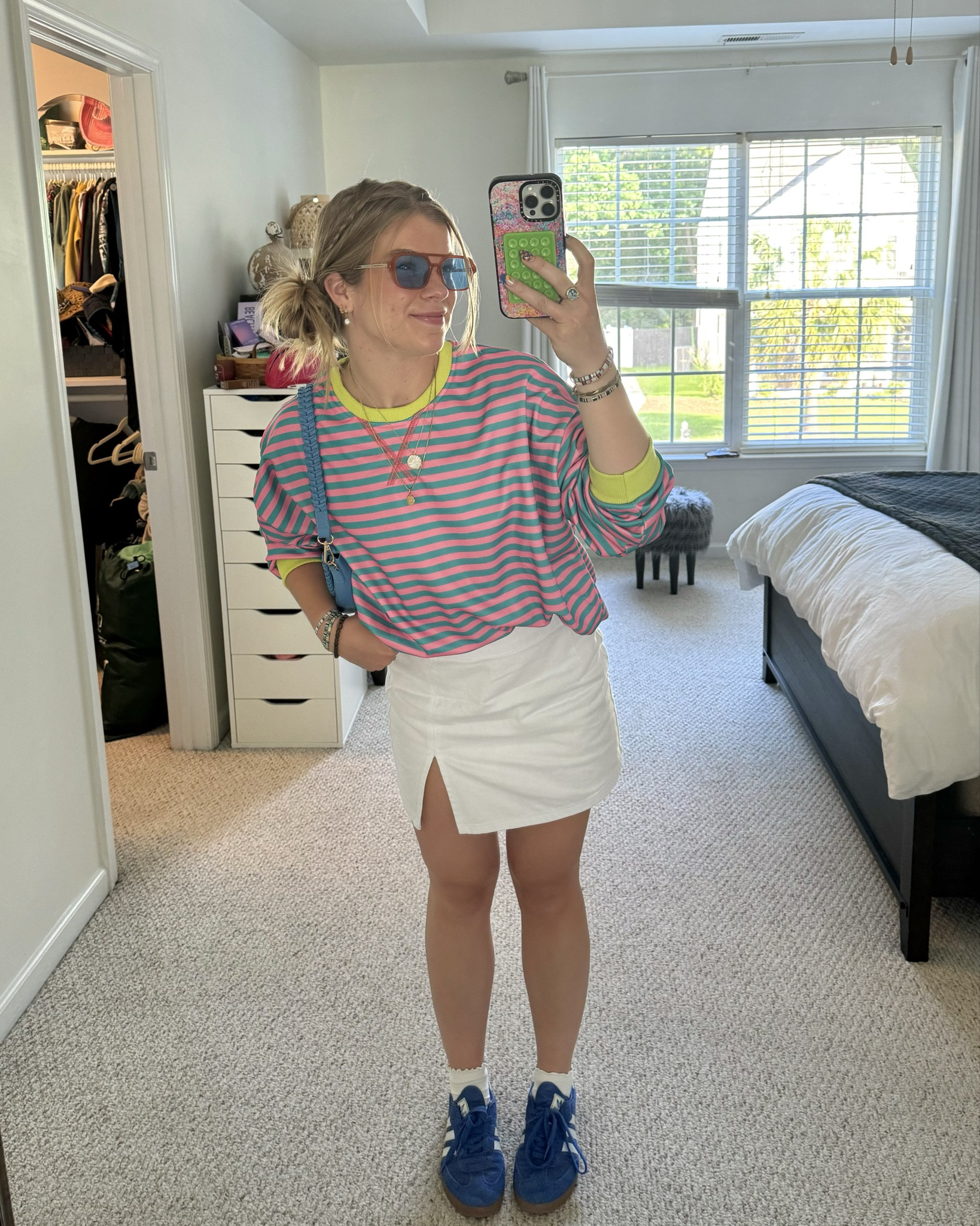 Such a fun and colorful look 🦋🌸🍀 

Shop my look, outfit ideas, outfits, summer outfit, spring outfit, colorful outfit, eclectic, maximalist, stripes, white skirt, blue sneakers, adidas, blue purse

#LTKStyleTip #LTKShoeCrush #LTKSeasonal