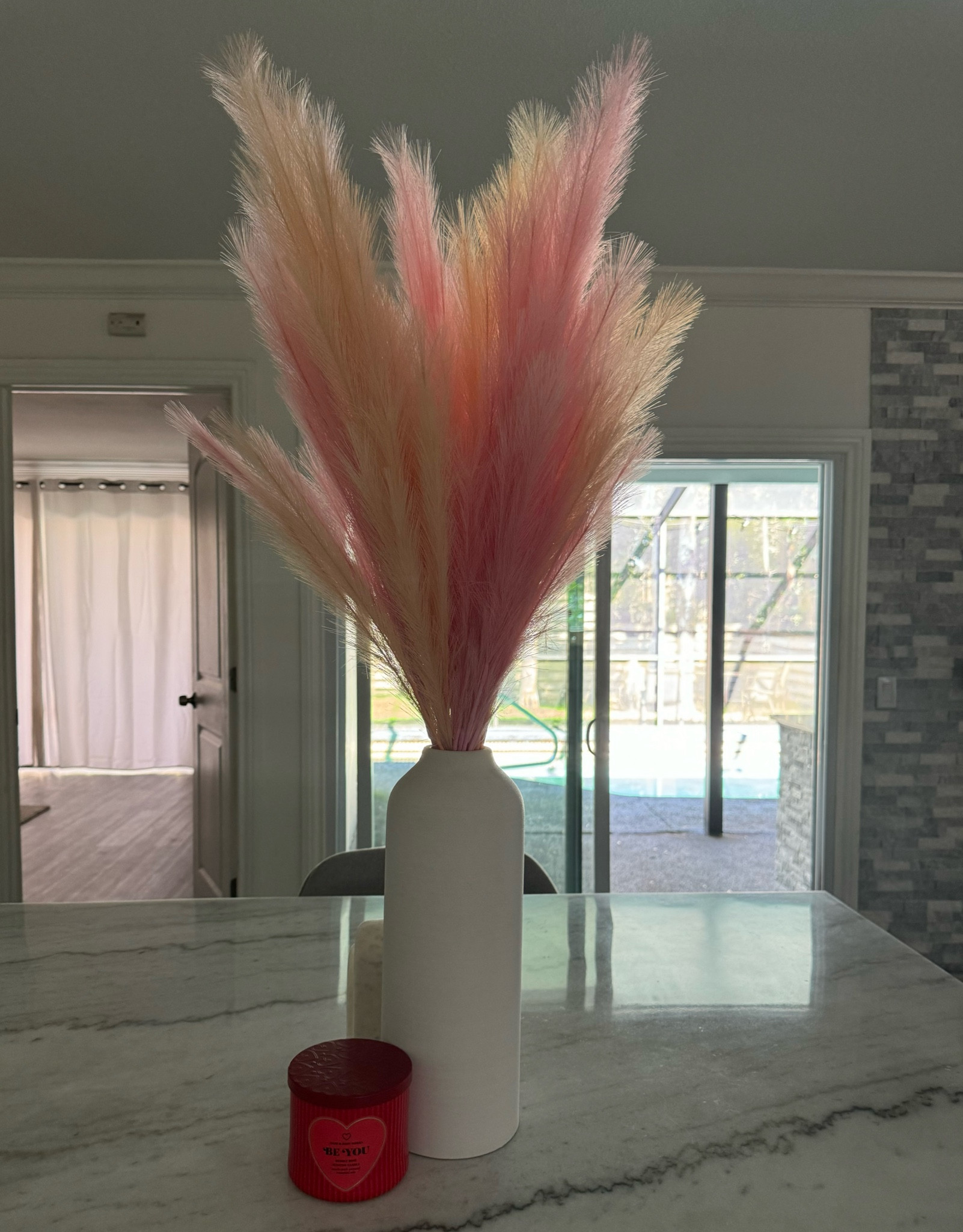 Beautiful light pink and peach pompass grass with a textured white threshold ceramic vase from Target. Perfect for Valentines Day & Easter 💓

#LTKsalealert #LTKhome #LTKSeasonal