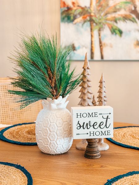 It’s the small touches I love the most when decorating for Christmas. And yes, I did keep my pineapple vase on my dining room table but switched out my palm leaves for pine branches. 

I don’t know about you, but a few years ago, I decided to steer clear of decorations with sparkles on them. I couldn’t stand every time you moved them having to clean up sparkles. What are your thoughts on that? 

#LTKSeasonal #LTKhome #LTKHoliday