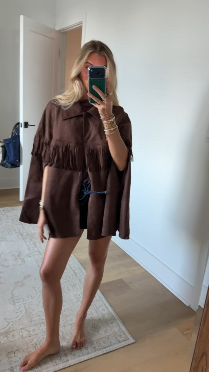 Walmart size s/m Wrap yourself in effortless sophistication with this Faux Suede Fringe Cape from Scenario. The soft, drapey finish gives it a luxe, suede-like feel, and long fringe trim adds movement and a touch of boho elegance. Designed for easy layering, it slips over sweaters, long-sleeve tops or dresses to elevate your look without added bulk. A versatile statement piece that transitions seamlessly from day to night. Only at Walmart.