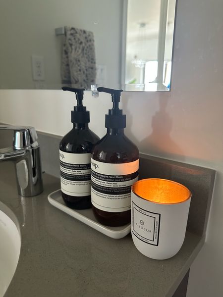 Some bathroom must haves for that fancy hotel feeling 🧖🏾‍♀️ the candle has that coconut, but woody smell. The hand soap and balm are hands down the best in the business and have a beautiful fruity and earthy smell. And I just love this towel by opal house - it’s neutral but has character 

#LTKhome #LTKunder50 #LTKunder100