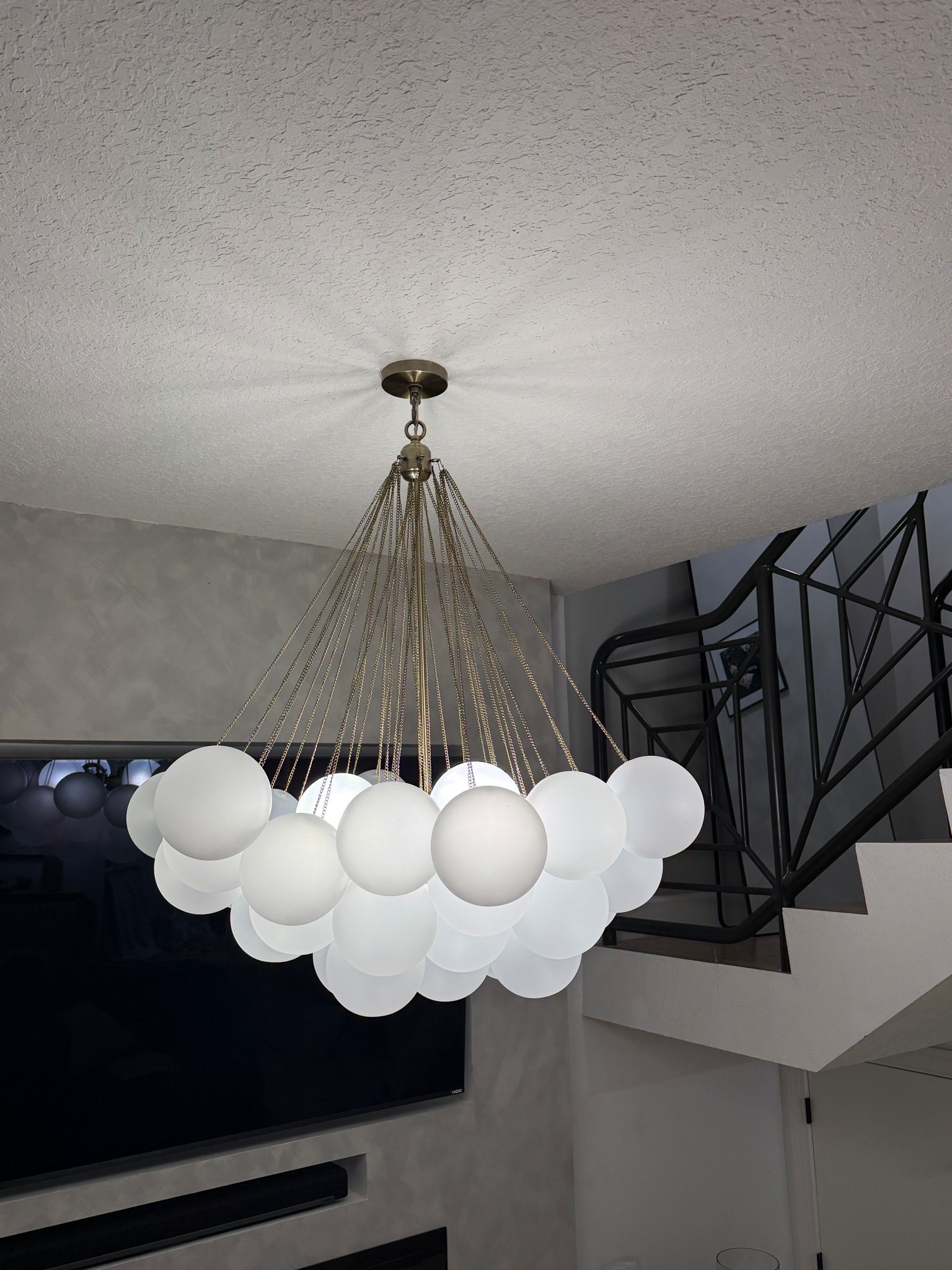 Zgallerie glass chandelier 🩵 includes a long brass chair for taller ceilings if needed. I didn’t use it. #zgallerie #modernchandelier #modernhome 

#LTKHome #LTKSaleAlert #LTKSeasonal