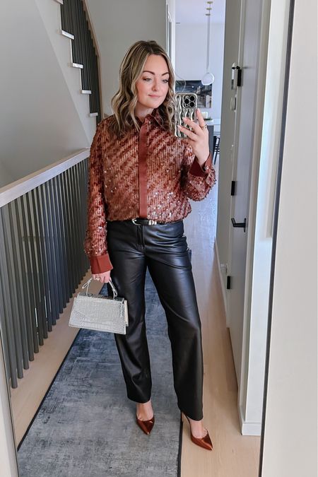 Date night outfit idea. Copper blouse, faux leather pants, a silver bag, and a western-inspired belt. 

#LTKSeasonal #LTKfindsunder100 #LTKstyletip