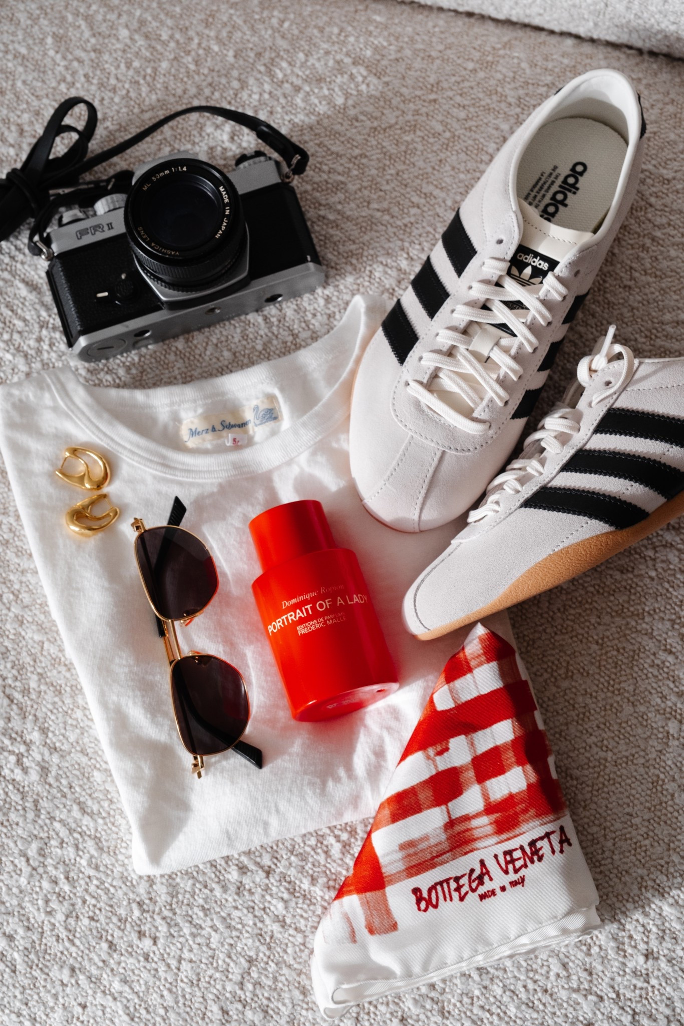 Spring accessories: Adidas Tokyo sneakers, a silk scarf from Bottega, thin gold frame sunglasses, and Portrait Of A Lady perfume  

#LTKspring #LTKstyletip #LTKbeauty