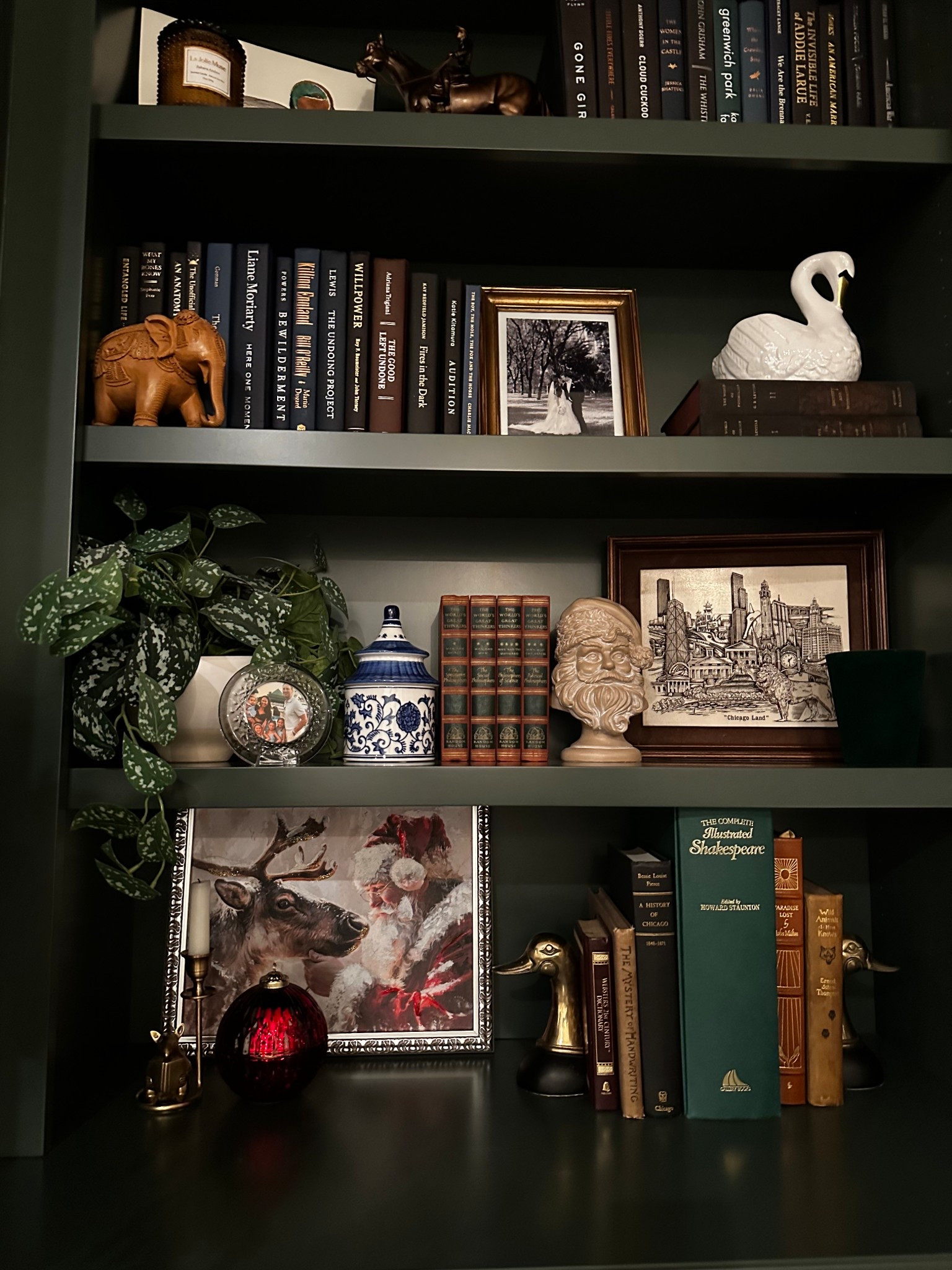 Starting Christmas decor early this year-playing around with the first few additions 

Santa art 
Santa bust
Candles
Built in shelves 
Ralph Lauren
Moody 

#LTKSeasonal #LTKHoliday