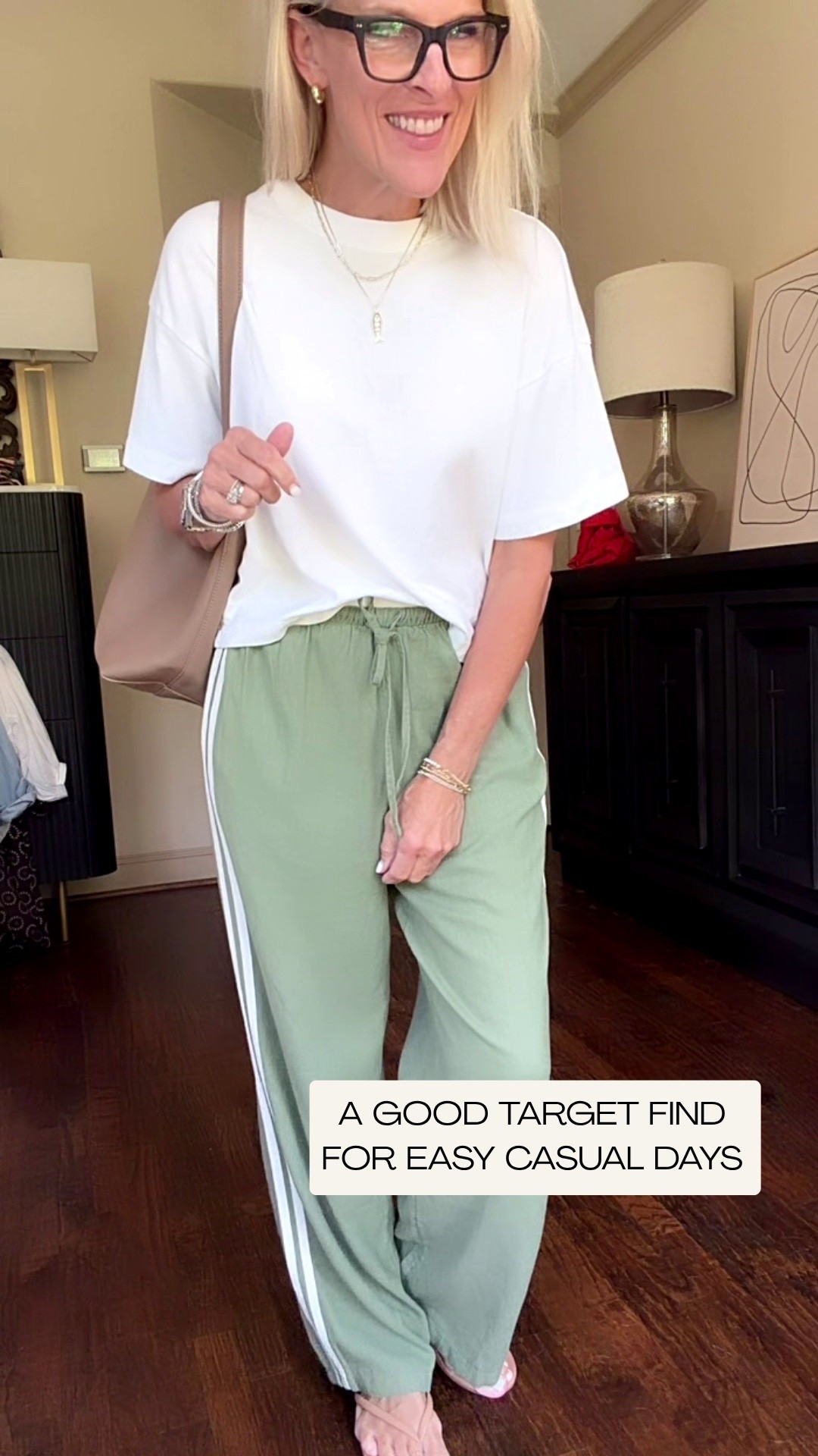 These Target track pants are such a fun, easy addition to my casual wardrobe! The lightweight linen-blend fabric, relaxed fit, and sporty double side stripes make them comfortable without looking sloppy. I’m wearing a small, and they fit true to size. I paired them with a simple white tee and sandals, but they’d be just as cute with a tank, lightweight sweater, or sneakers.

💡 LTK MADE EASY
❤️ Heart = Support my posts!
🔖 Save = Get sale & restock alerts
📋 Lists = Keep favorites organized
📲 Share = Send lists and products to a friend. Hello, Christmas List!
💬 Comment = Ask me anything about what I’m wearing.:-)

#LTKootd #LTKOver40