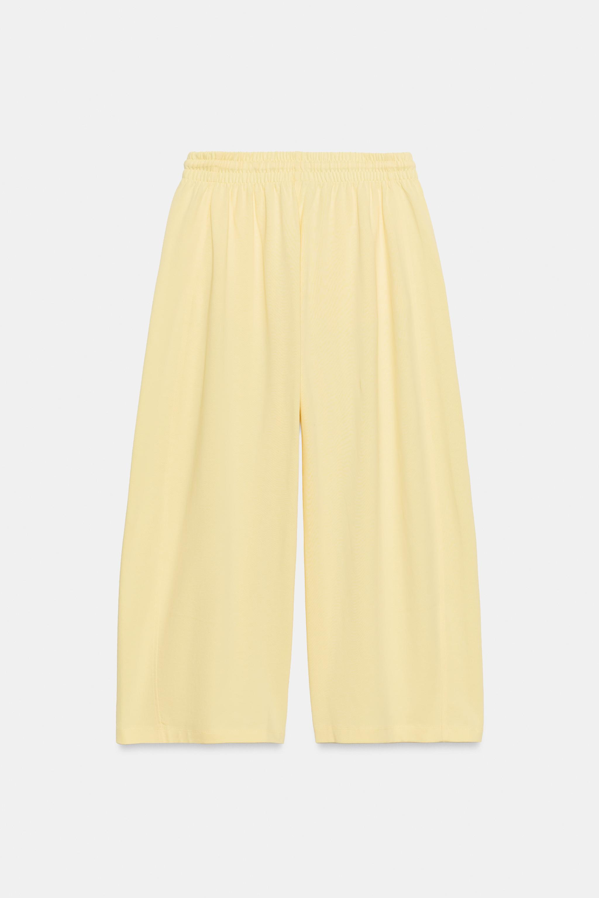 Trousers made of cotton spun fabric. Mid-waist with an adjustable drawstring waistband. Featuring... | Zara UK