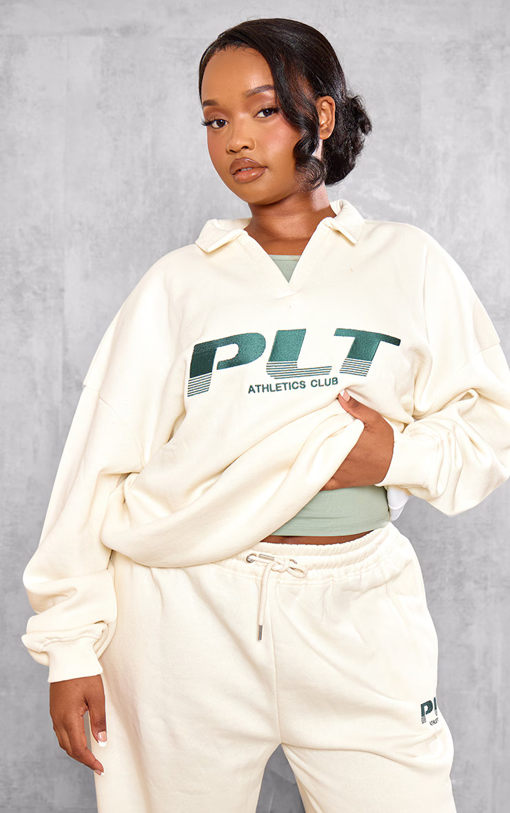 PRETTYLITTLETHING Plus Cream Athletics Club Embroidered Sweatshirt | PrettyLittleThing US