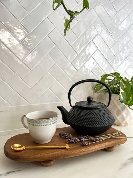 Create your own cast iron teapot stand using an old chopping board and wood stain to sit in a beautiful corner of your kitchen with a cup and saucer and decorative tea spoon 

#LTKhome #LTKunder50 #LTKeurope