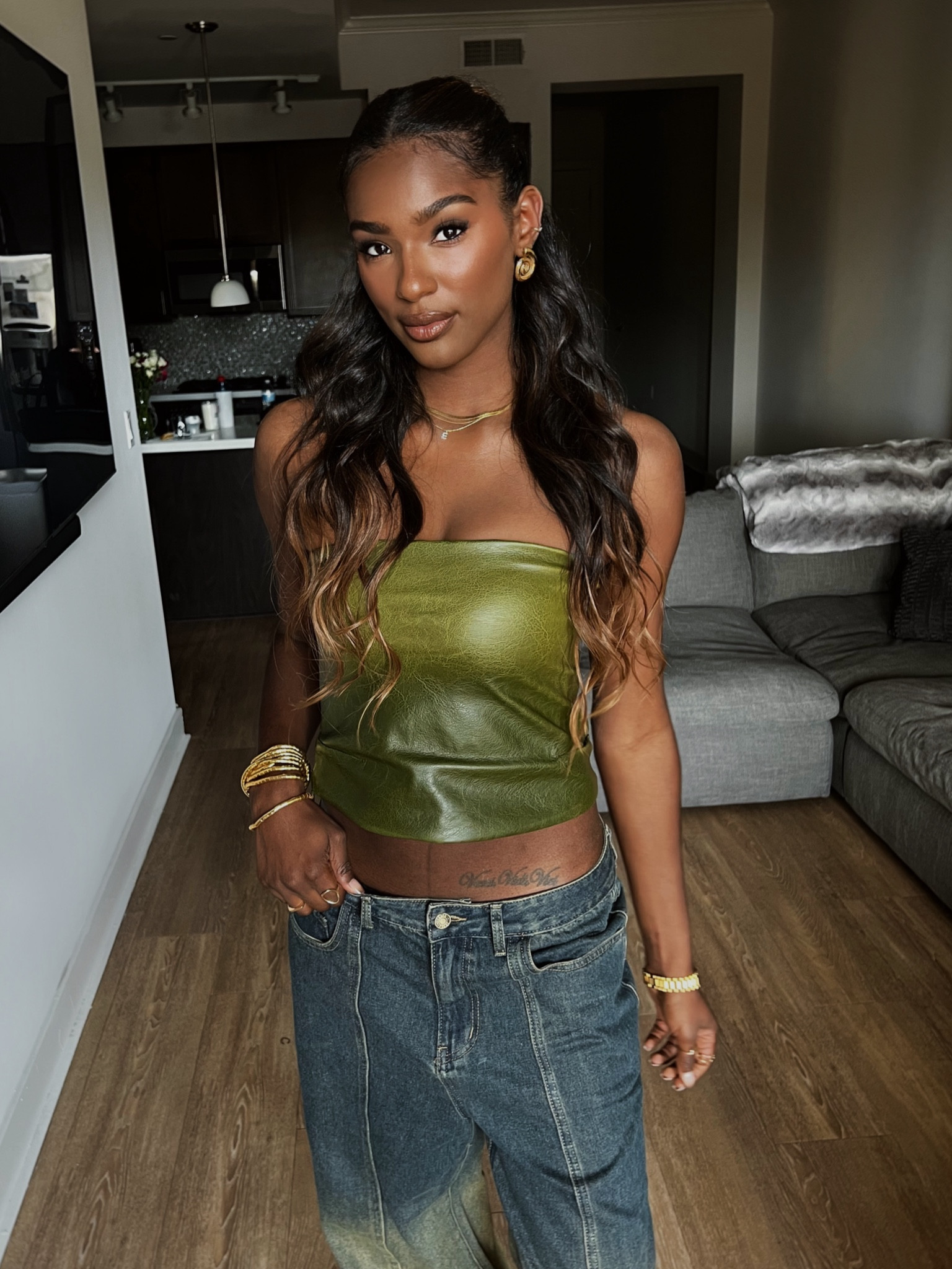 Best outfit of the year BY FAR!!! I’ve never felt more cool in an outfit 😂 so many compliments in this look. found this lightly boned leather bandeau top and paired it with these low rise baggy ombre jeans to add edge to the overall look. So here for it. 

#LTKFindsUnder100 #LTKStyleTip #LTKItBag