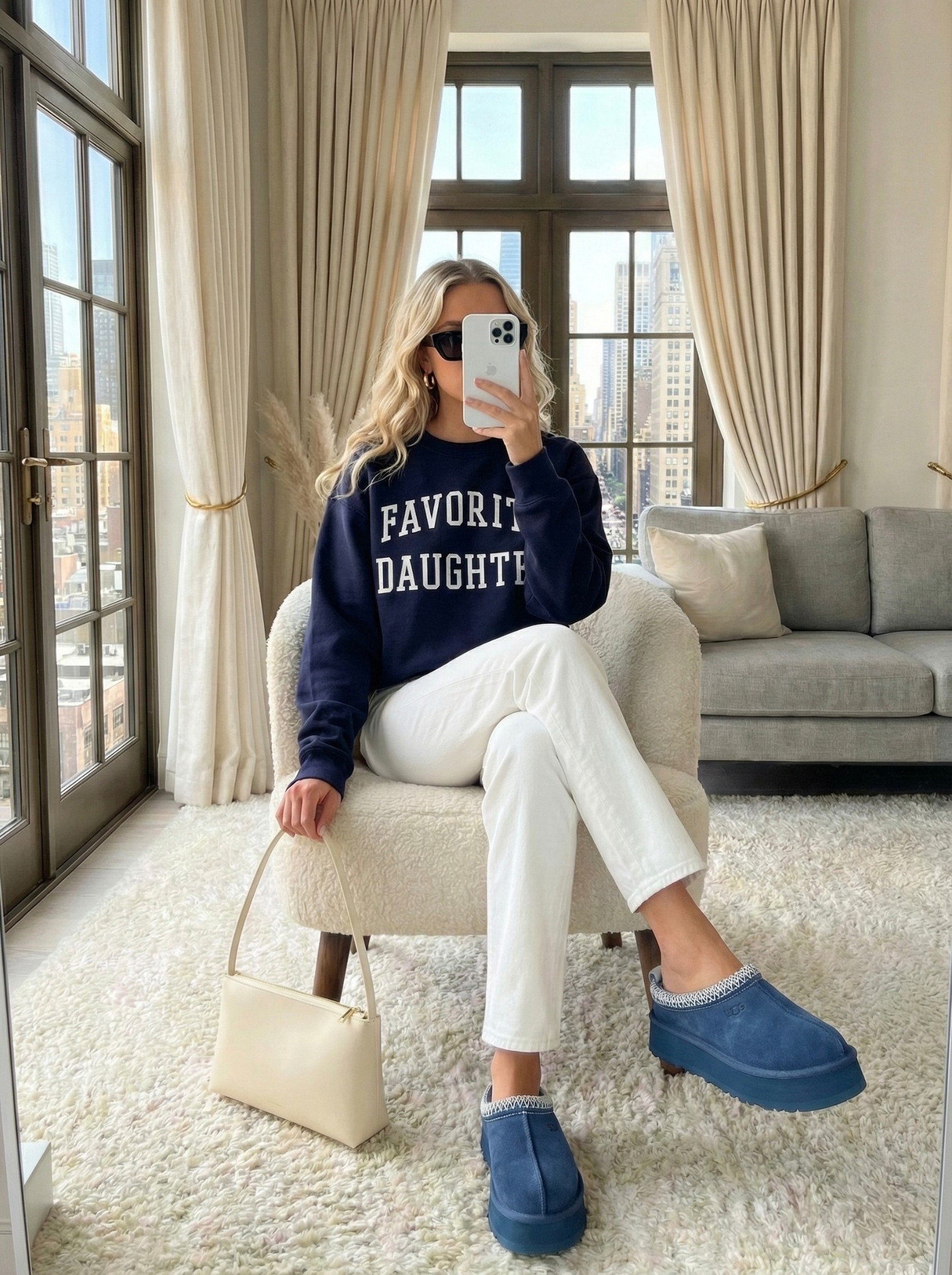 Favorite Daughter sweatshirt and platform slippers outfit 💙☁️

The perfect casual look for running errands or a relaxed weekend. Styling this trending navy graphic crewneck with crisp white jeans and blue platform clogs for maximum comfort and style.

Style Details:
• Navy "Favorite Daughter" graphic sweatshirt
• White straight-leg jeans
• Blue platform suede slippers (Tazz style)
• Cream shoulder bag
• Black sunglasses & gold hoops

Recreate this easy everyday look with the similar styles linked below!

What is your go-to comfortable shoe for errands: slippers or sneakers? 👇

#LTKSeasonal #LTKcasual #LTKstyletip


#LTKHoliday #LTKootd #LTKgrwm