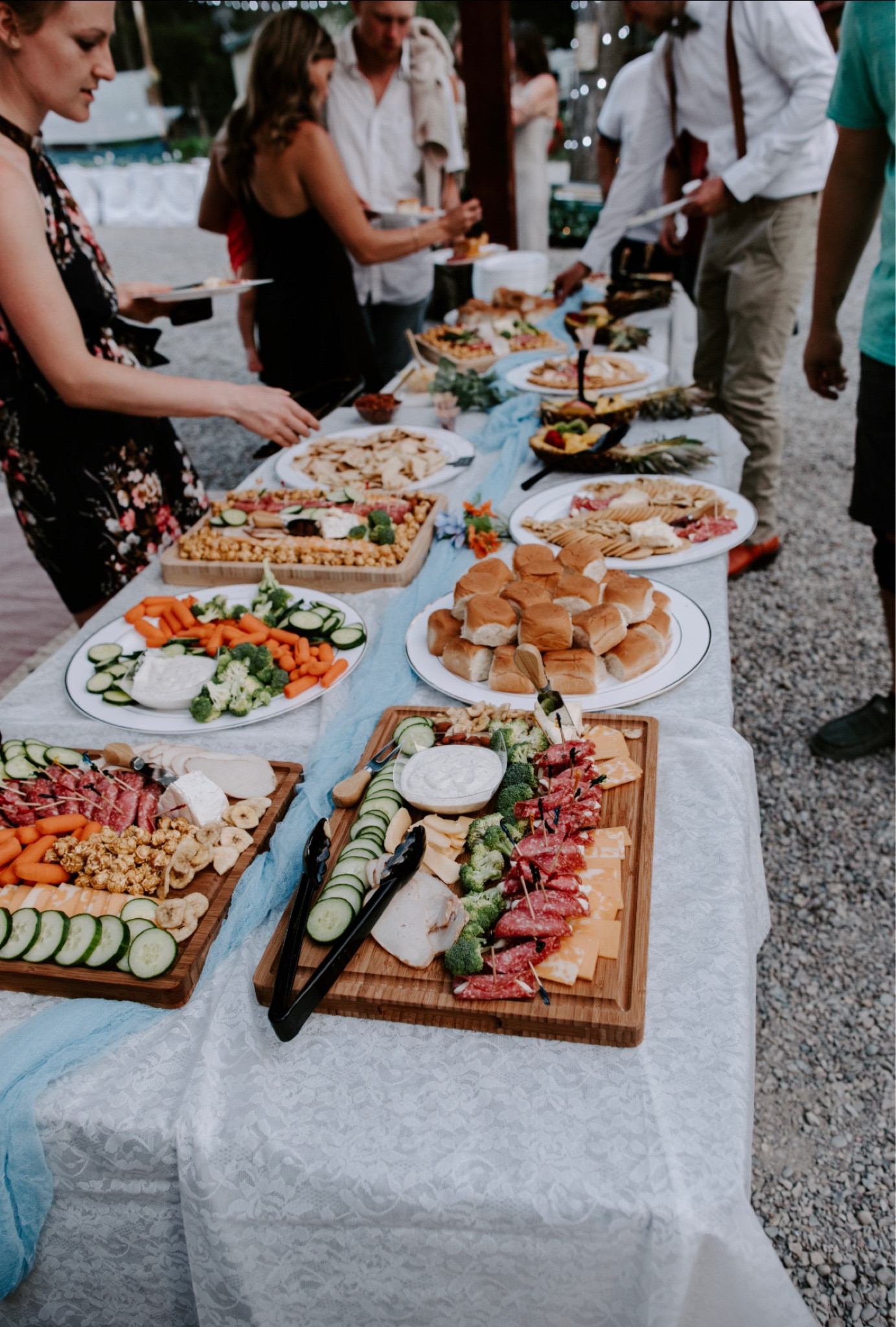 At our wedding we decided to have a charcuterie board meal being that our wedding was held later in the day! These were perfect for it! We had gauze table runners on every table which added a touch of decor! The table cloths were from hobby lobby, as well as the serving plates :) #LTKWedding 