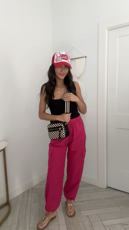 Cute travel outfit wearing square neck bodysuit and pink cargo pants. Cute summer outfit  

#LTKFindsUnder50 #LTKTravel #LTKStyleTip