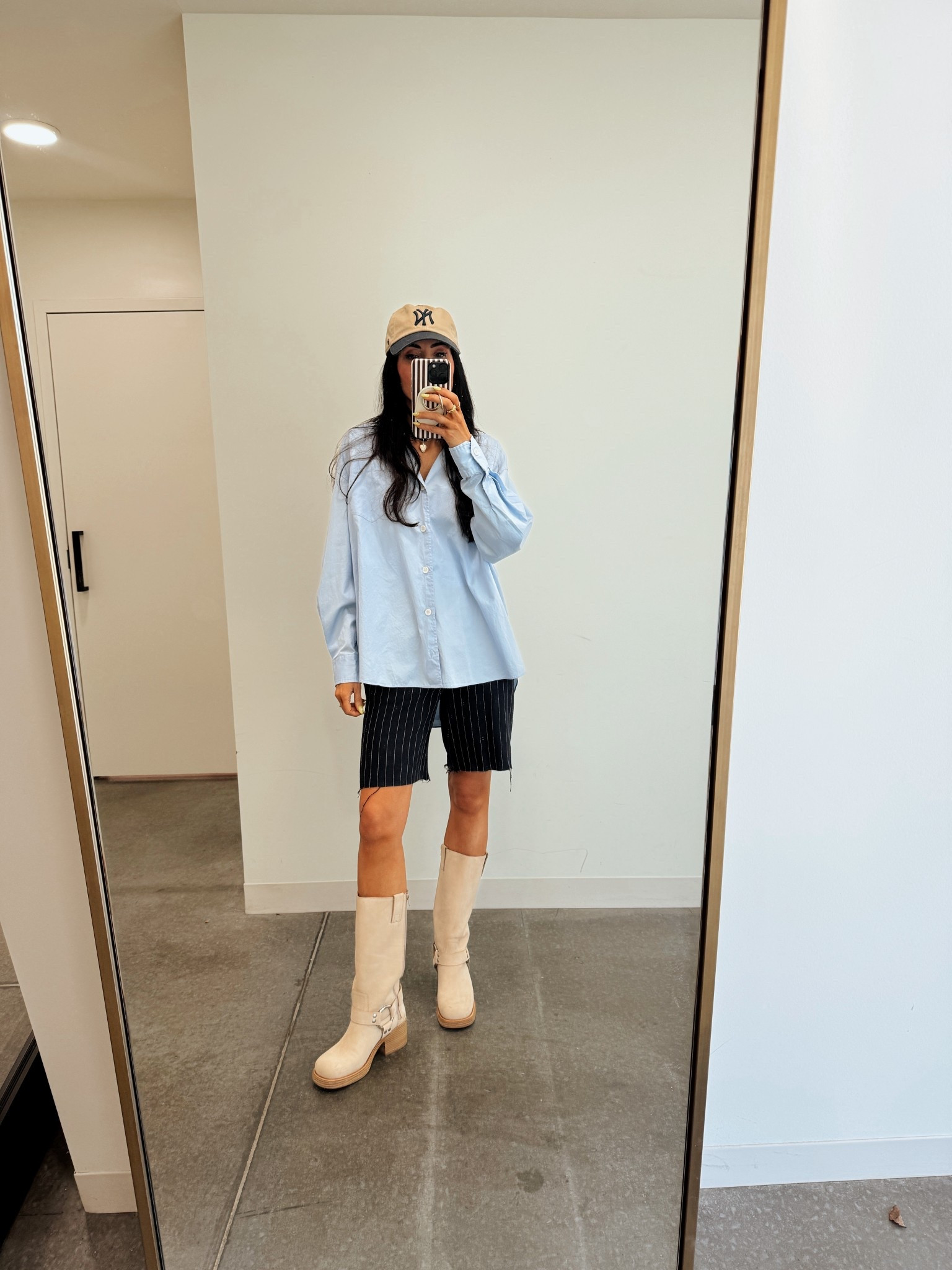 Long shorts plus an oversized oxford. 