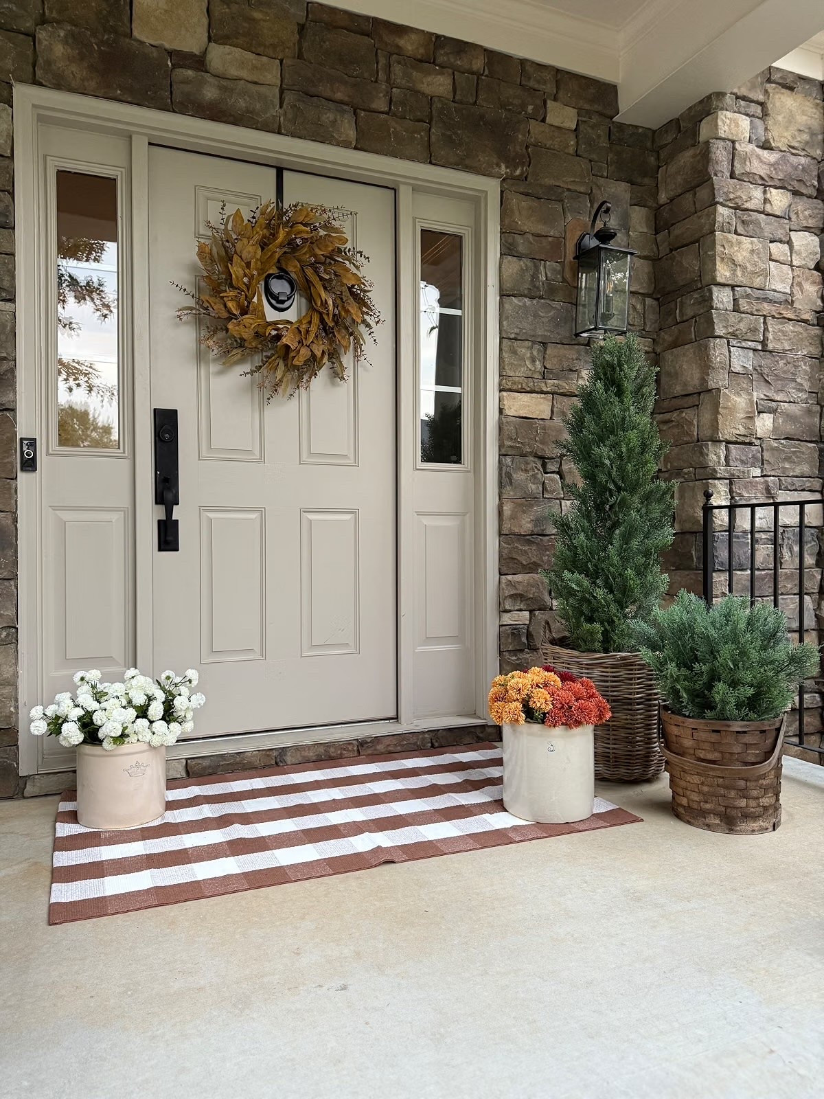 My favorite kind of fall decor is the kind that makes your home feel cozy the second you walk up. A few mums, some greenery, a pretty wreath, and the cutest plaid mat are all it takes to give your front porch that fall feeling.

#LTKHome #LTKSeasonal