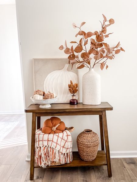 Fall entryway decor console table with neutral pumpkin art, rustic vase with brown floral stems for fall, pumpkin plush pillow, hops stems, fall decorating , neutral fall decor 

#LTKsalealert #LTKhome #LTKSeasonal