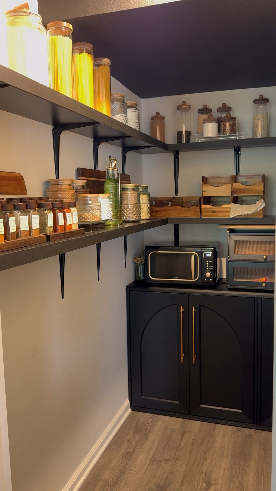 Parisian-inspired pantry organization meets modern functionality. Black cabinetry with brass hardware, floating shelves, glass jars, and wooden accents create a luxe but practical space. Perfect for storing spices, grains, and everyday essentials in style.

Shop airtight jars, wood storage bins, and sleek black kitchen cabinets to recreate this elevated look for your home.

#PantryOrganization #LTKHome #ParisianHome #SoftLuxuryLiving #KitchenGoals


#LTKStyleTip #LTKFindsUnder50 #LTKHome