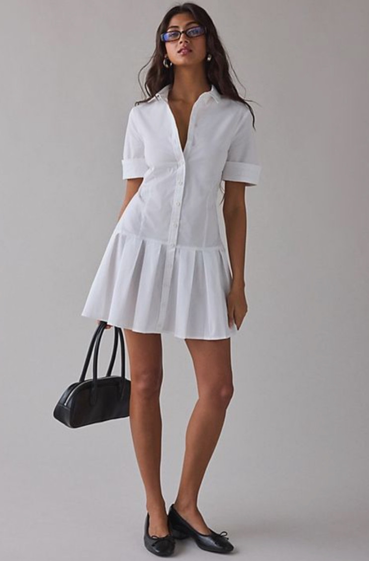 Chic white shirt dress outfit with a collared mini dress, pleated hem, black ballet flats, and a structured handbag for an elevated everyday look.
Style tip: choose a tailored shirt dress to create a clean, structured silhouette, and pair it with classic accessories like ballet flats and a minimalist handbag to achieve a timeless, polished outfit that works for day-to-day wear. 

 

#LTKootd