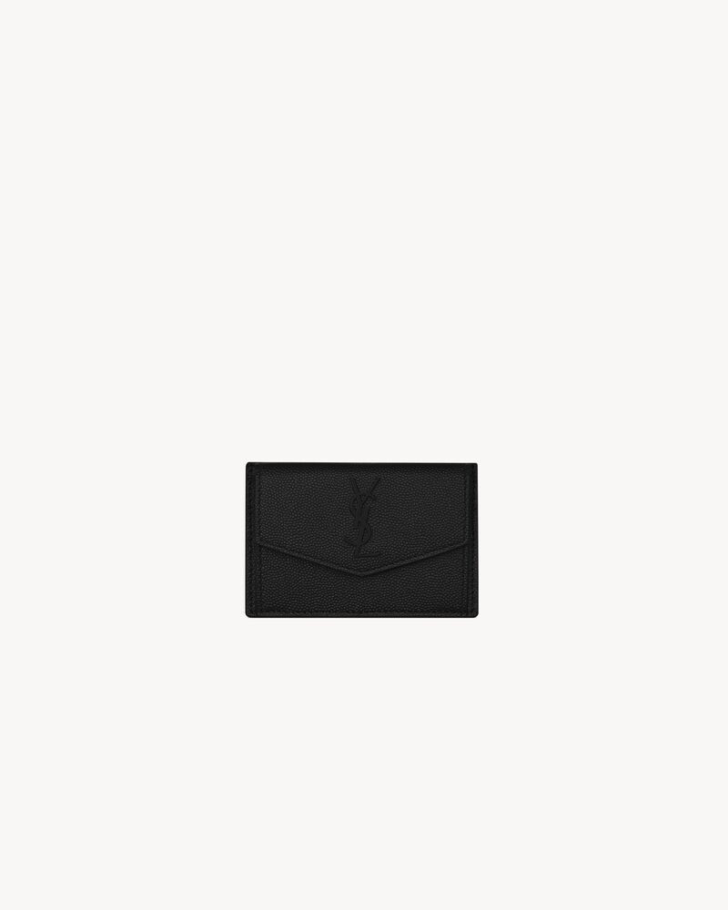Card case with flap, decorated with interlaced metal YSL initials. | Saint Laurent Inc. (Global)
