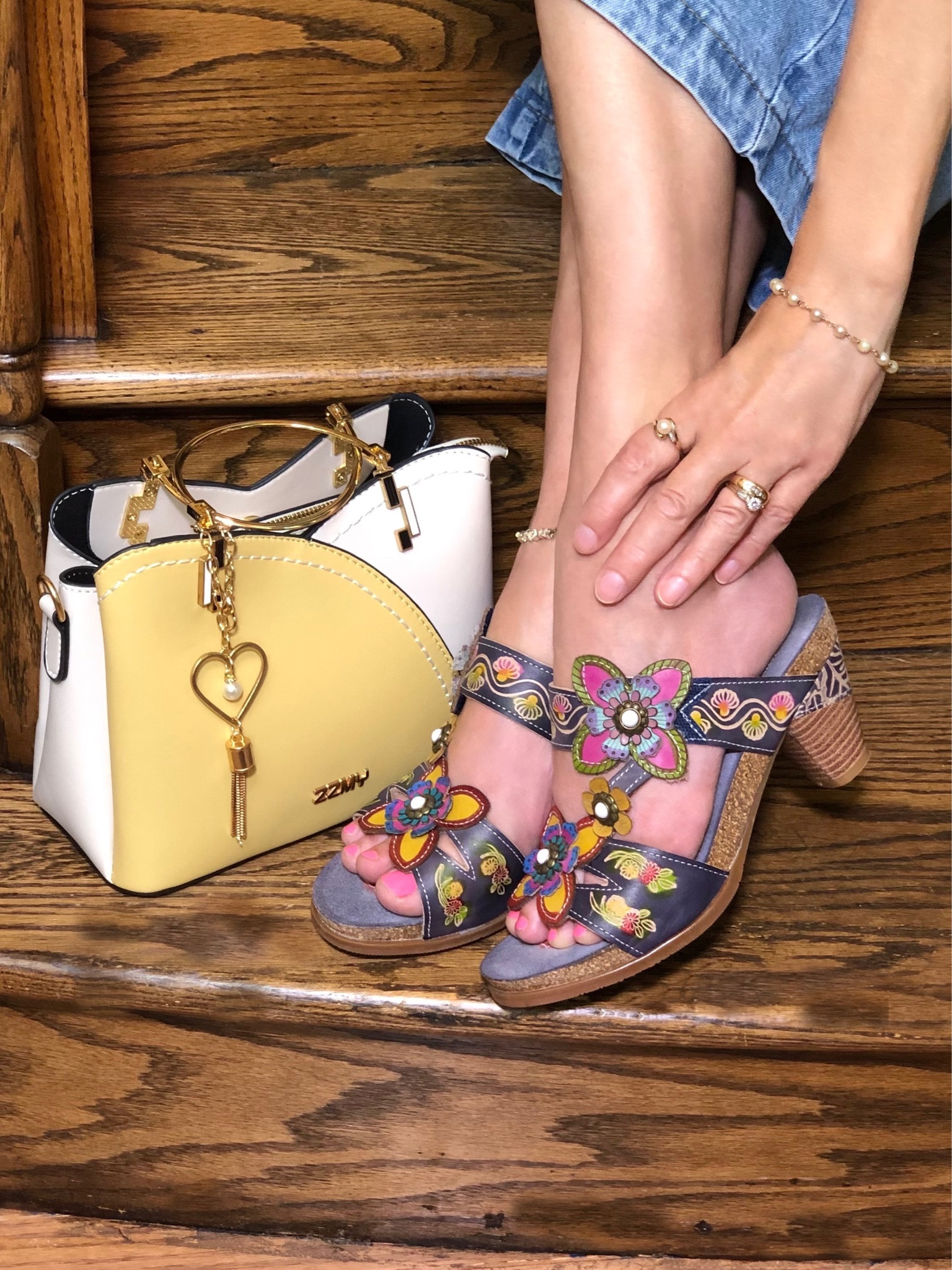 I have wanted a pair of shoes from the L’ Artiste collection for quite a few years but could never decide on which design and style—I loved them all!  When I saw these sandals this year, I had no doubt that this was the pair! Plus, with the padded footbed, they are so comfy to walk in all day. I also love the color blend in the design.  The shoes in this collection really do look like works of art!
Paired the shoes with this adorable two-toned bag that picked up the yellow tones! I’ve always loved ring-handle bags! This comes with a detachable strap. With a center zip section and 2 separate snap sections,  there is plenty of room for wallet, makeup case, phone, and more!
I’ve linked all of these plus additional fall shoes that I love from the collection !