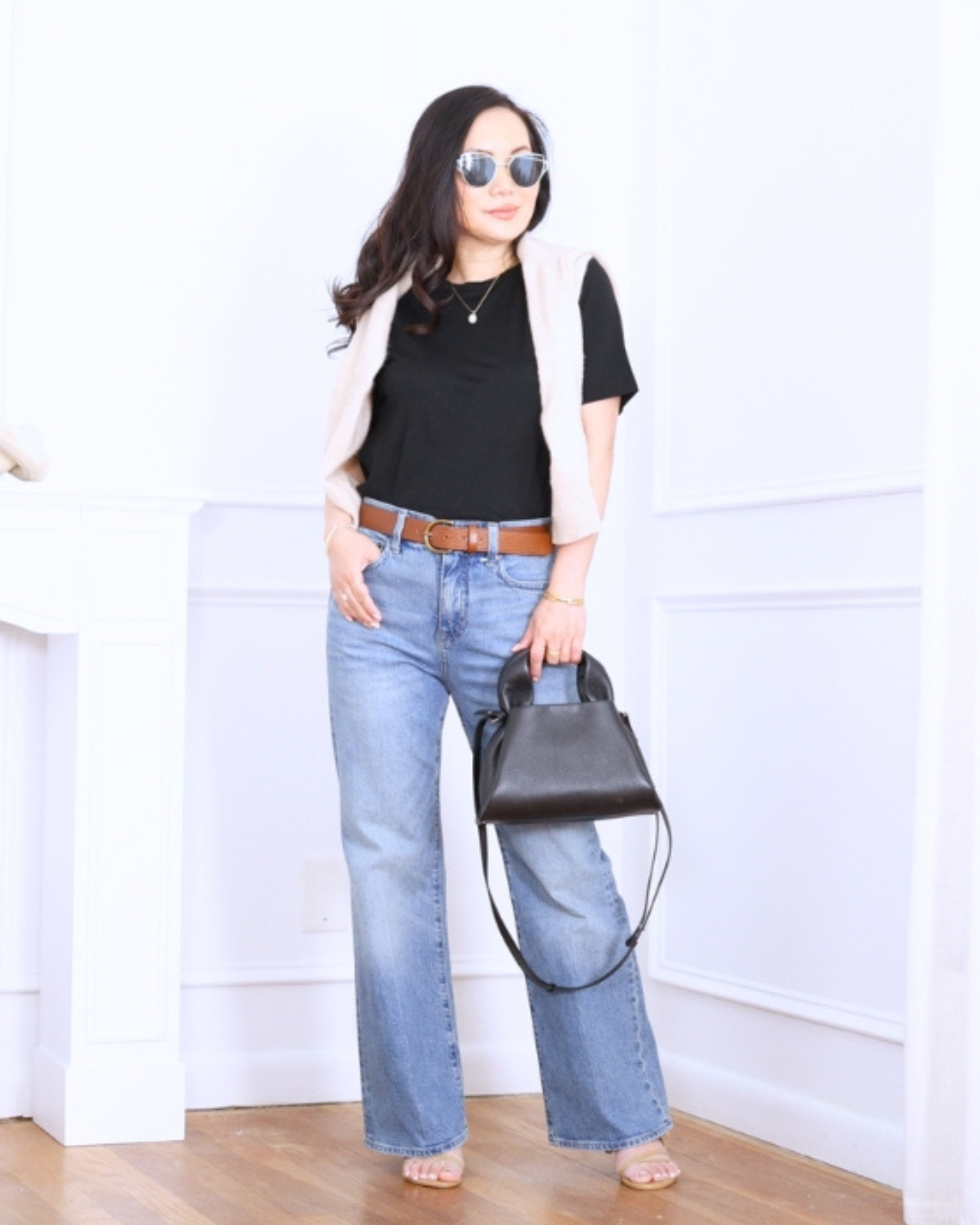 Black cropped tee from Uniqlo paired with J.Crew kick-flare jeans — minimal, flattering, and effortlessly cool for everyday wear. I'm 5'2, wearing size S. 

 #LTKootd #LTKOver40 #LTKPetite