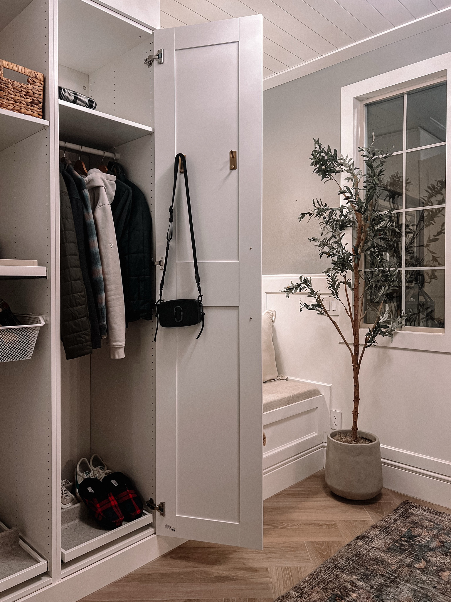 Proof that small details make a big impact! ✨

This organized drop zone/mudroom moment is giving warm, welcoming, and functional—exactly what you need when walking through the door after a long day. A few key pieces bring it all together:

✔️ Built-in storage to keep coats, shoes, and bags in check
✔️ A cozy bench for quick shoe changes (bonus: it doubles as extra seating!)
✔️ Gold hooks that add a little shine while keeping essentials handy
✔️ An olive tree to bring life and warmth to the space

It’s practical, but make it pretty. Because who says storage can’t have style? 🖤 Shop my favorite home organization and decor finds on my LTK! 

#MudroomGoals #OrganizedLiving #SmallSpaceSolutions #LTKHome

#LTKHome #LTKItBag