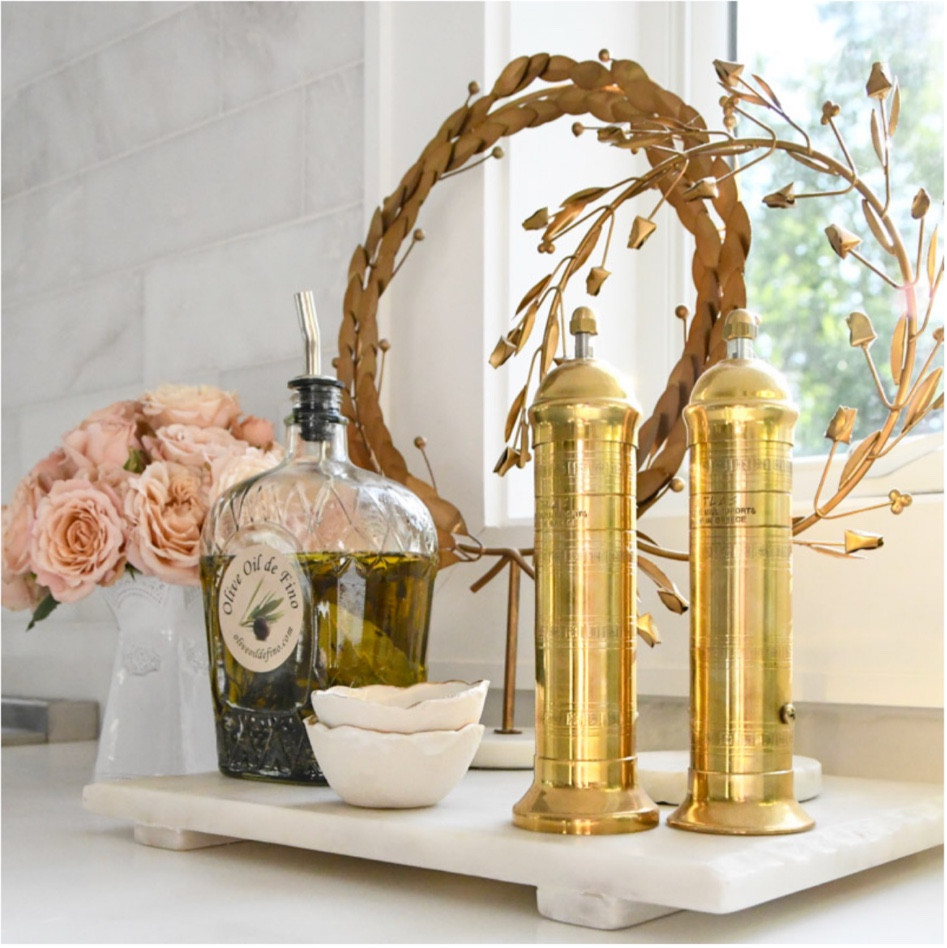 Kitchen home decor 
Brass salt and pepper mills
Marble board
Gold wreath on stand 

#LTKhome