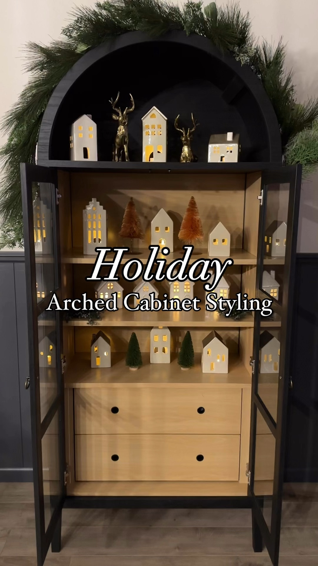 Turned my arched cabinet into a Christmas village this holiday season! 

Christmas decor, white ceramic houses, Christmas village, bottle brush trees, garland, black arched cabinet 

#LTKSeasonal #LTKWatchNow #LTKHoliday